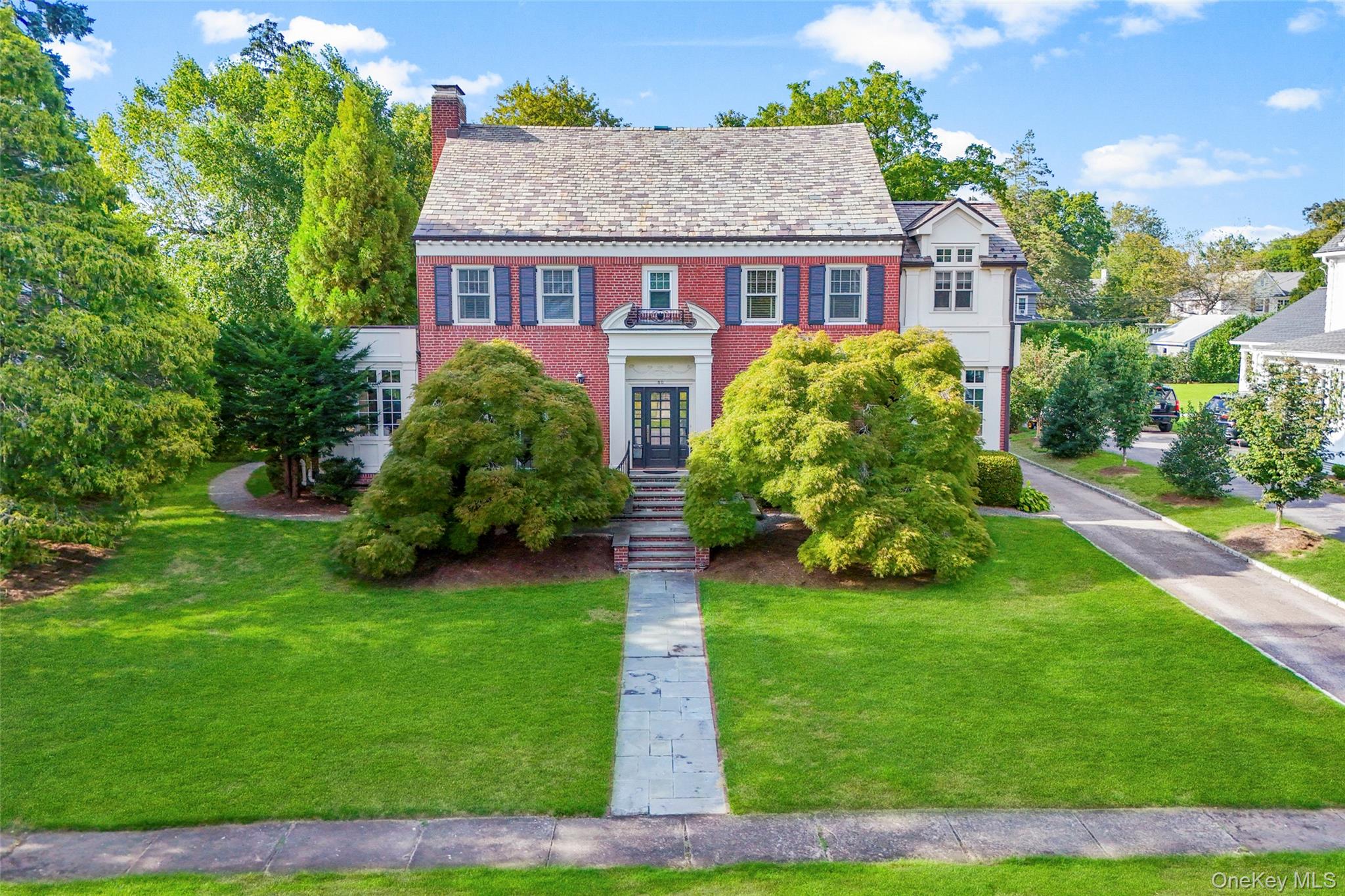 80 Forest Avenue, a brick Georgian Colonial in the sought-after Forest...