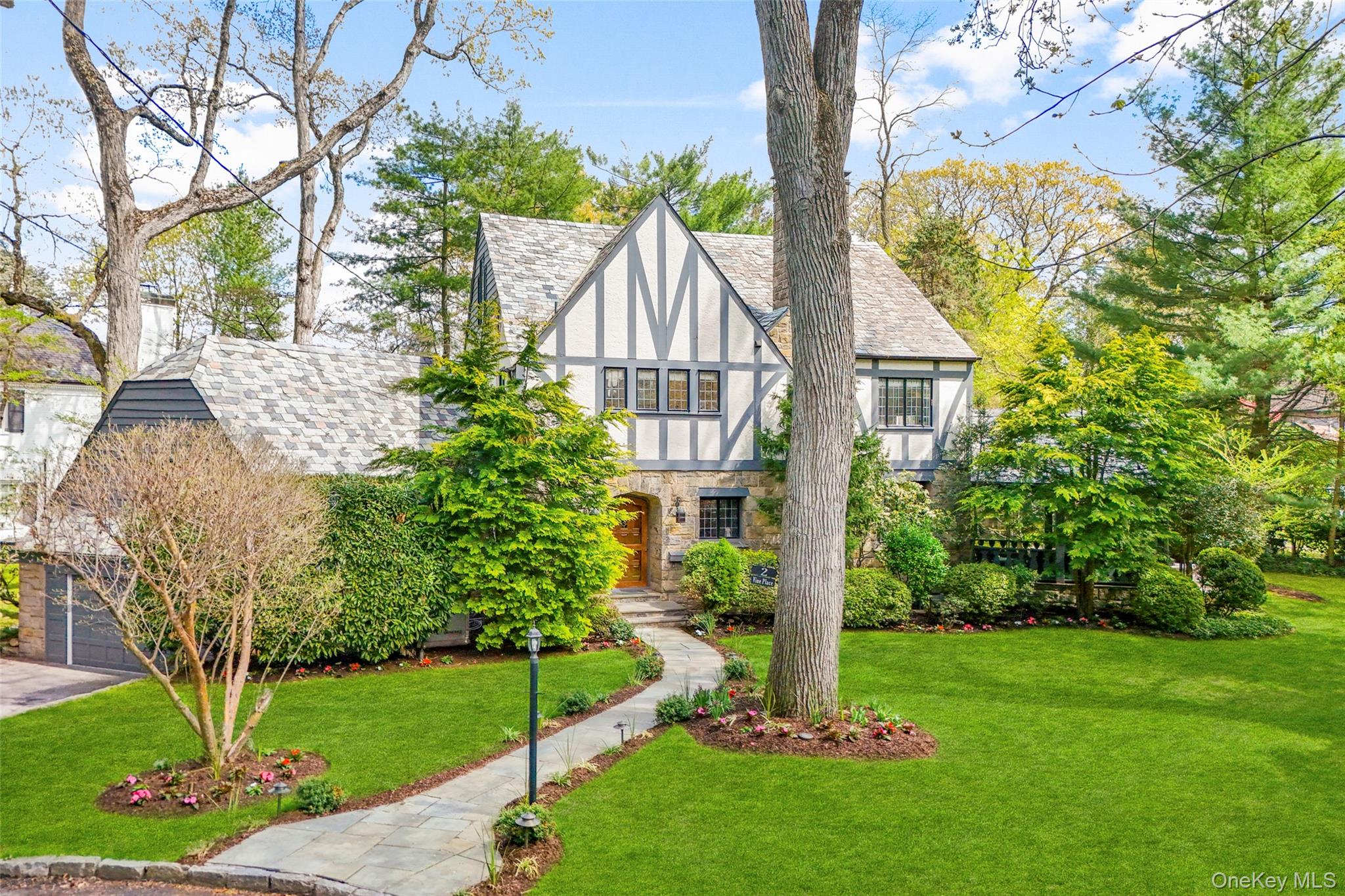 A 1930s Tudor, thoughtfully renovated with a modern, bright, and fresh...