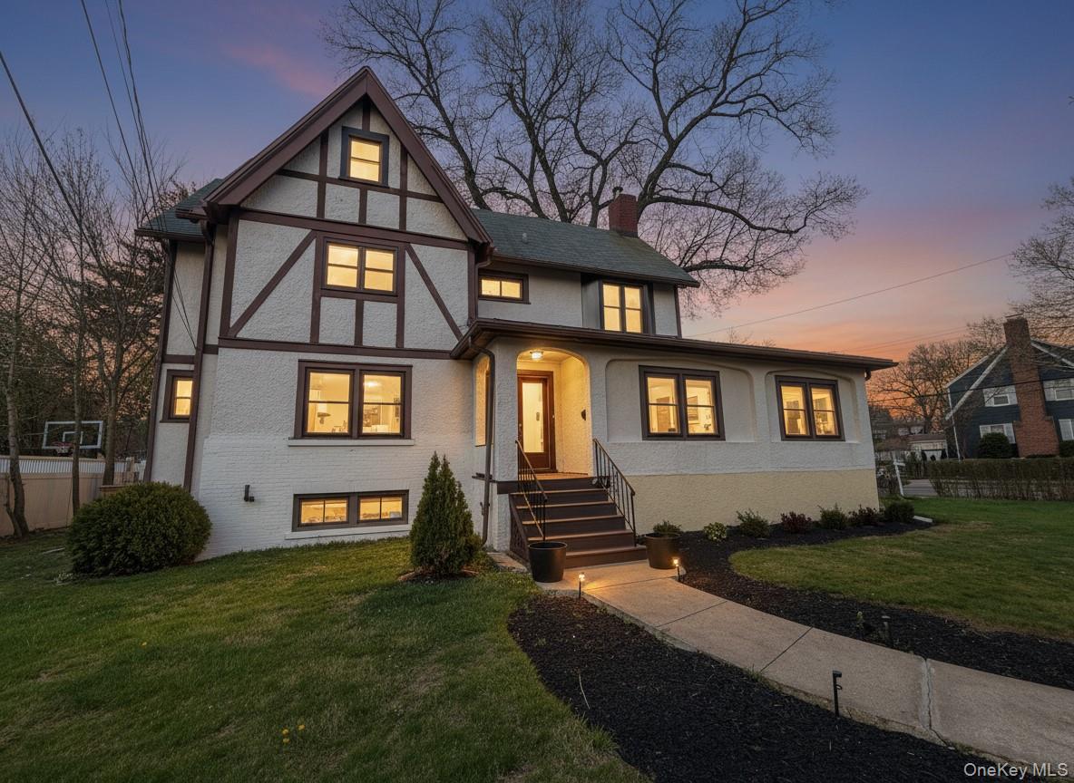 Stately Tudor home set on a prominent corner lot in the quiet Fisher H...
