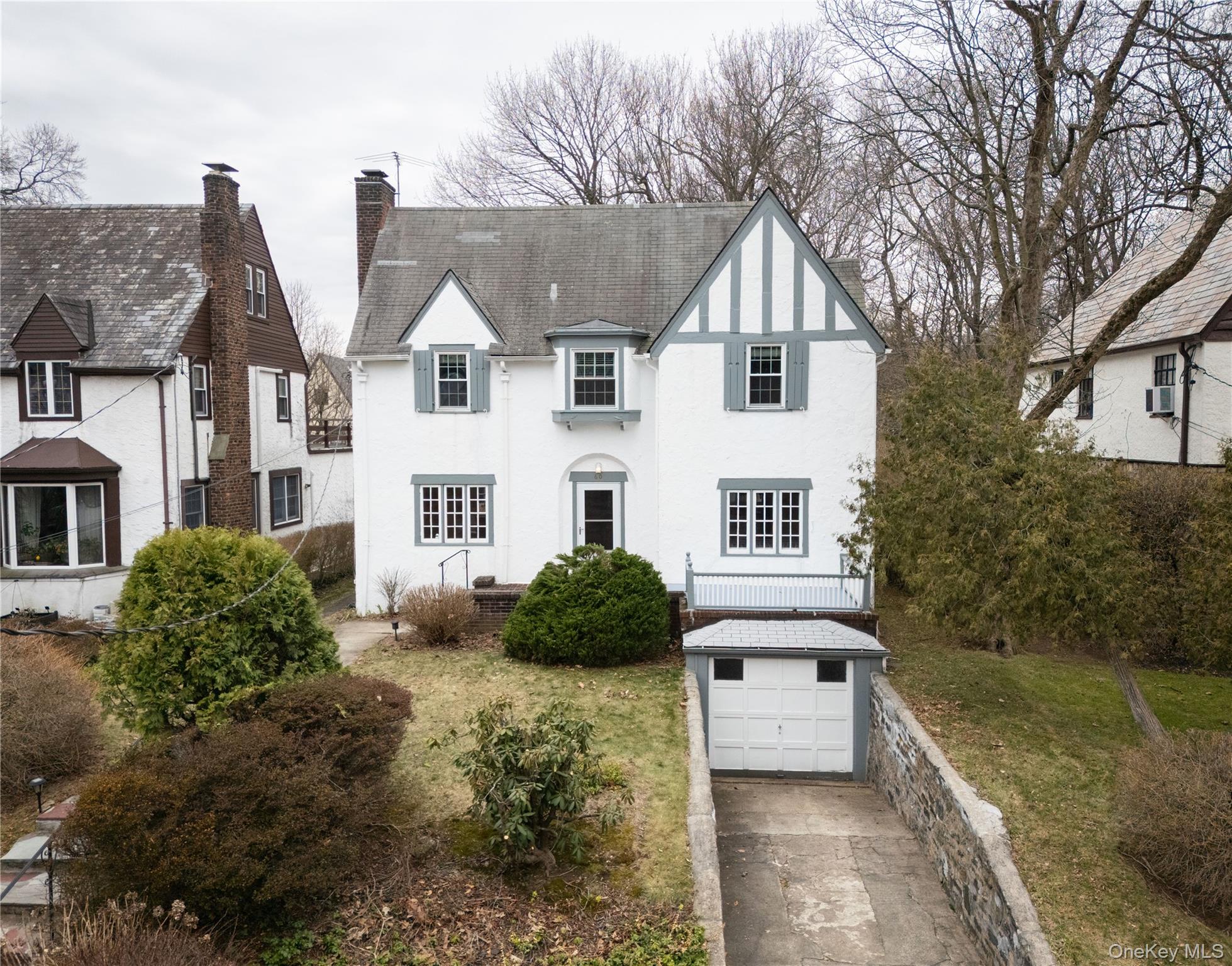 60 Parkway East is a lovely stucco colonial on a tree lined street sur...