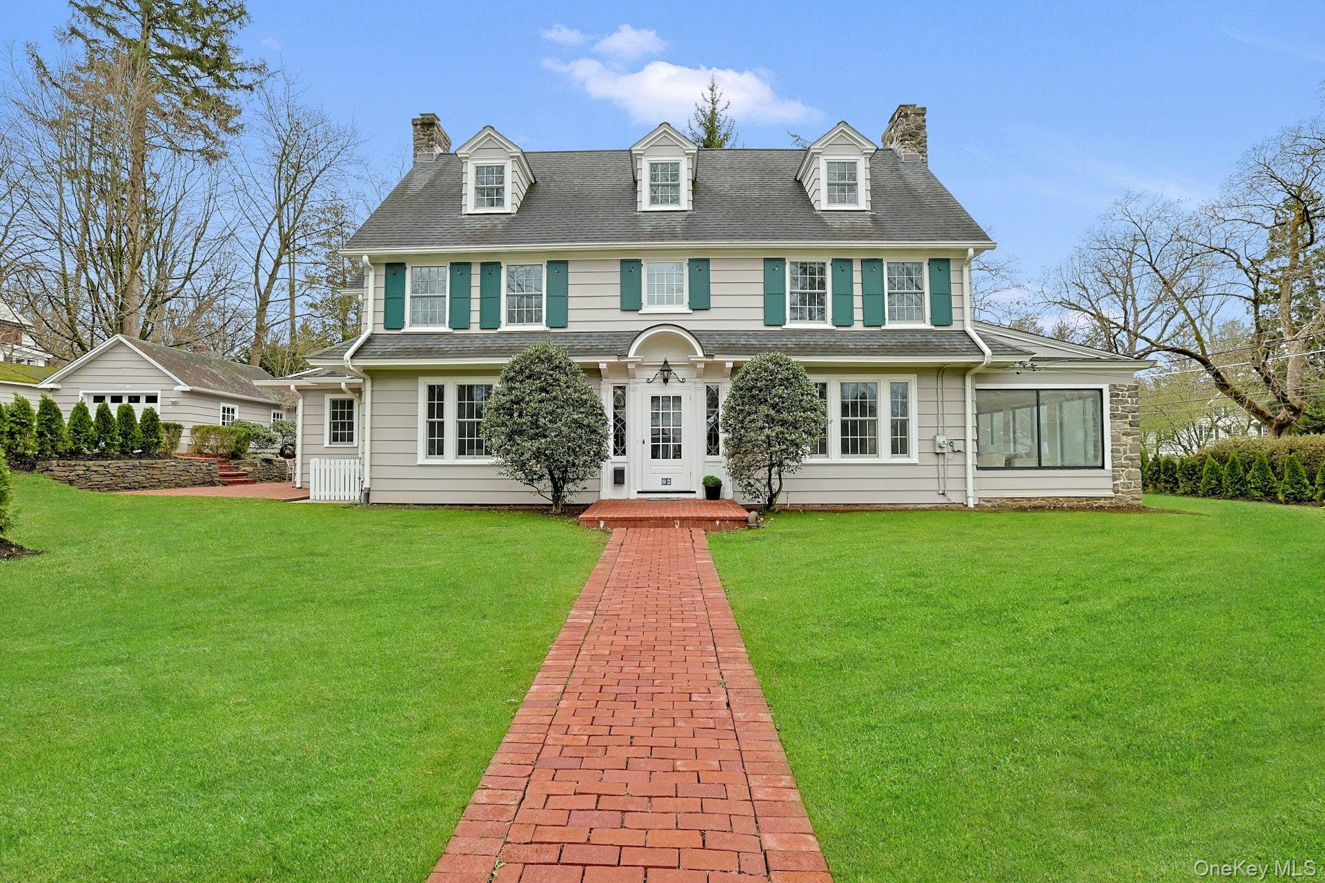 Welcome to 92 Walworth Avenue, a beautifully updated 1917 Center Hall...