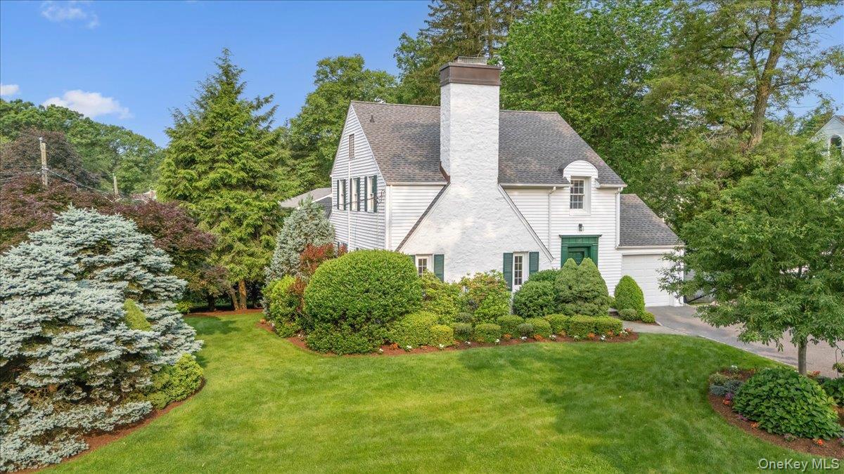 Beautiful, pristine Colonial sited on a magnificently landscaped, quie...
