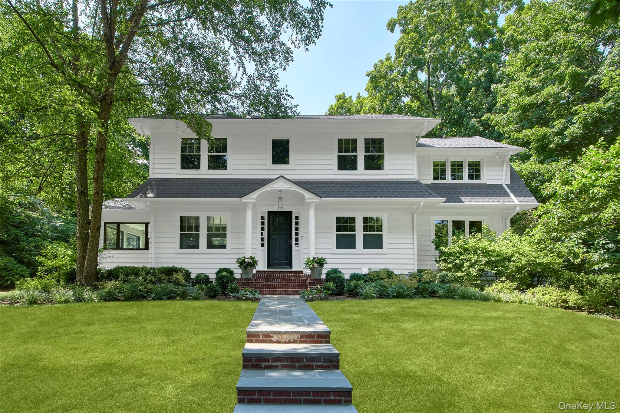 A truly exceptional offering, this picture-perfect 1930s Colonial blen...