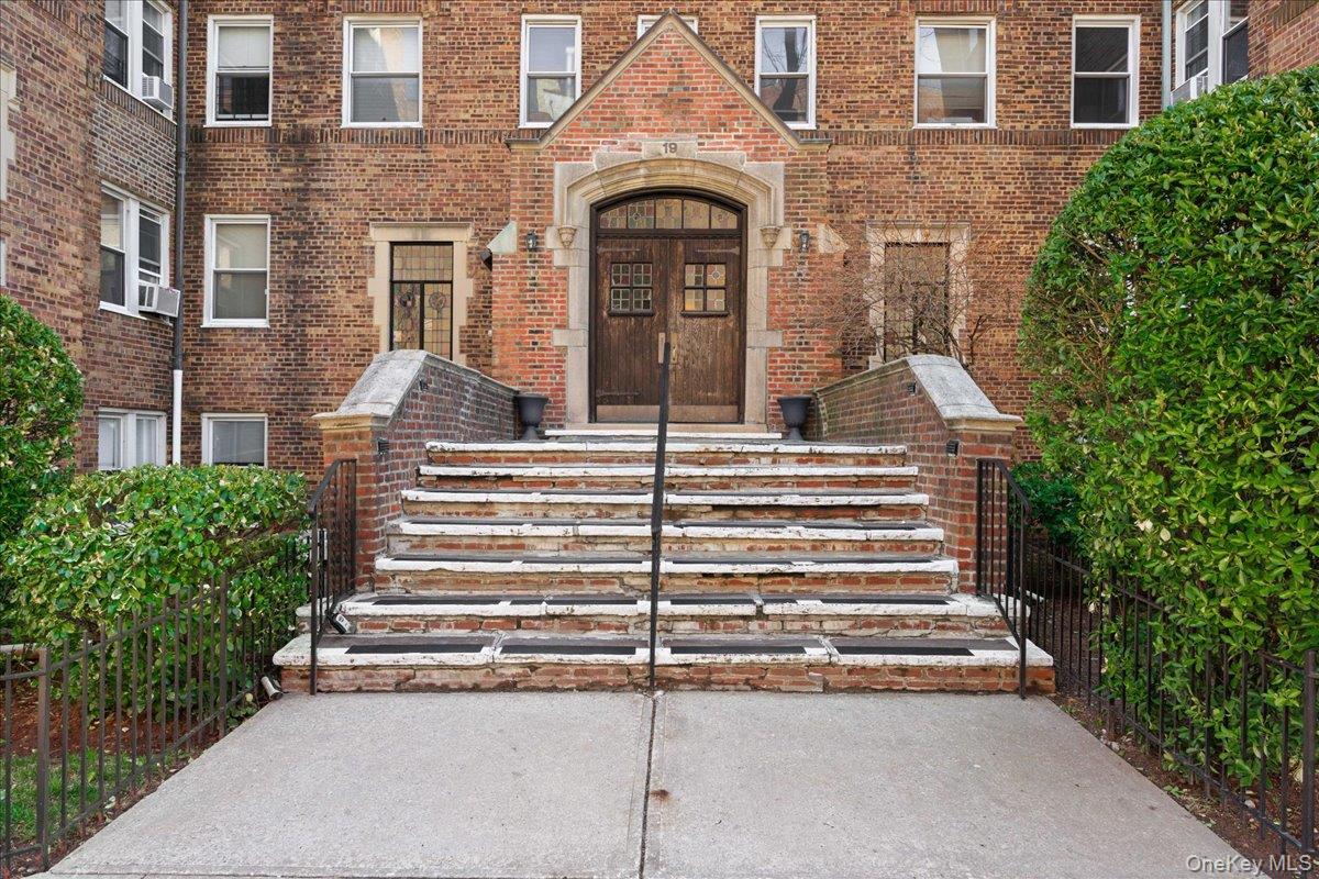 This sunlit two-bedroom unit blends classic 1935 Tudor Revival charm w...