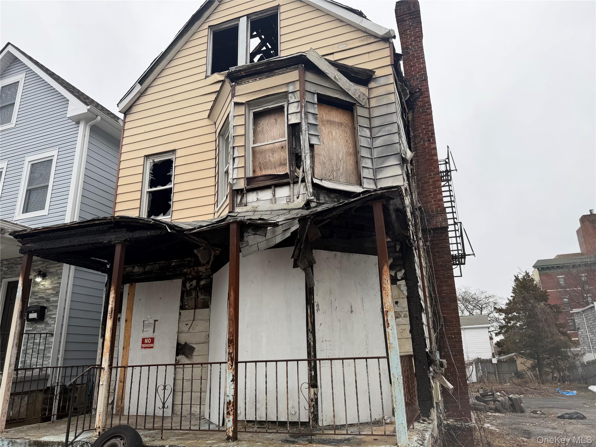 This detached, three-family home sits on an oversized 0.11-acre lot (4...