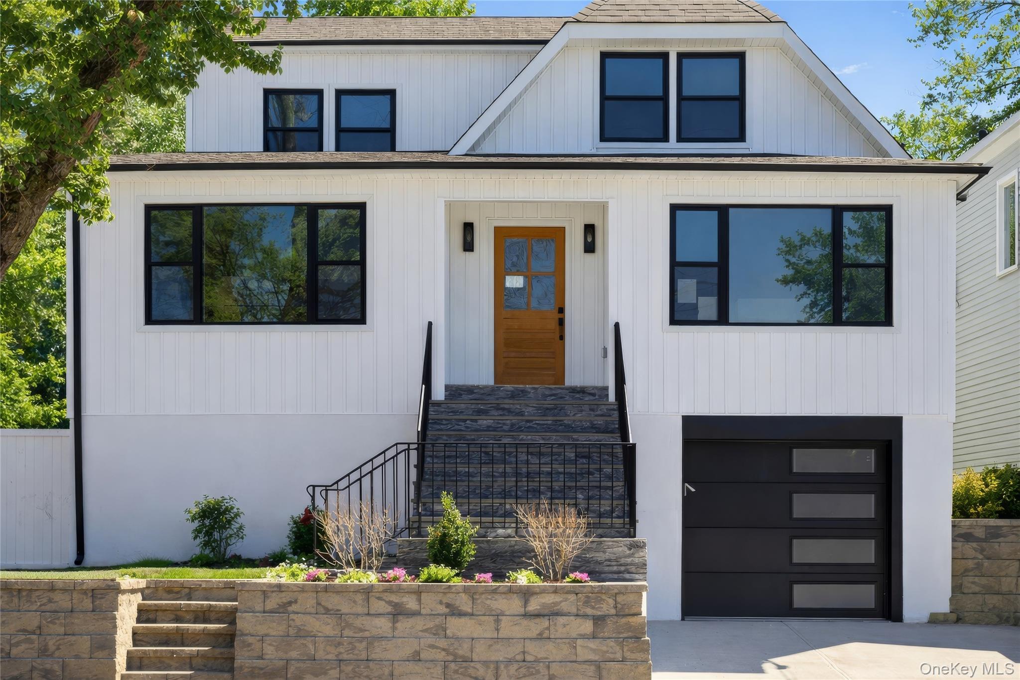 Welcome to 8 Hunt Avenue, a masterful renovated 4-bedroom, 3-full-bath...