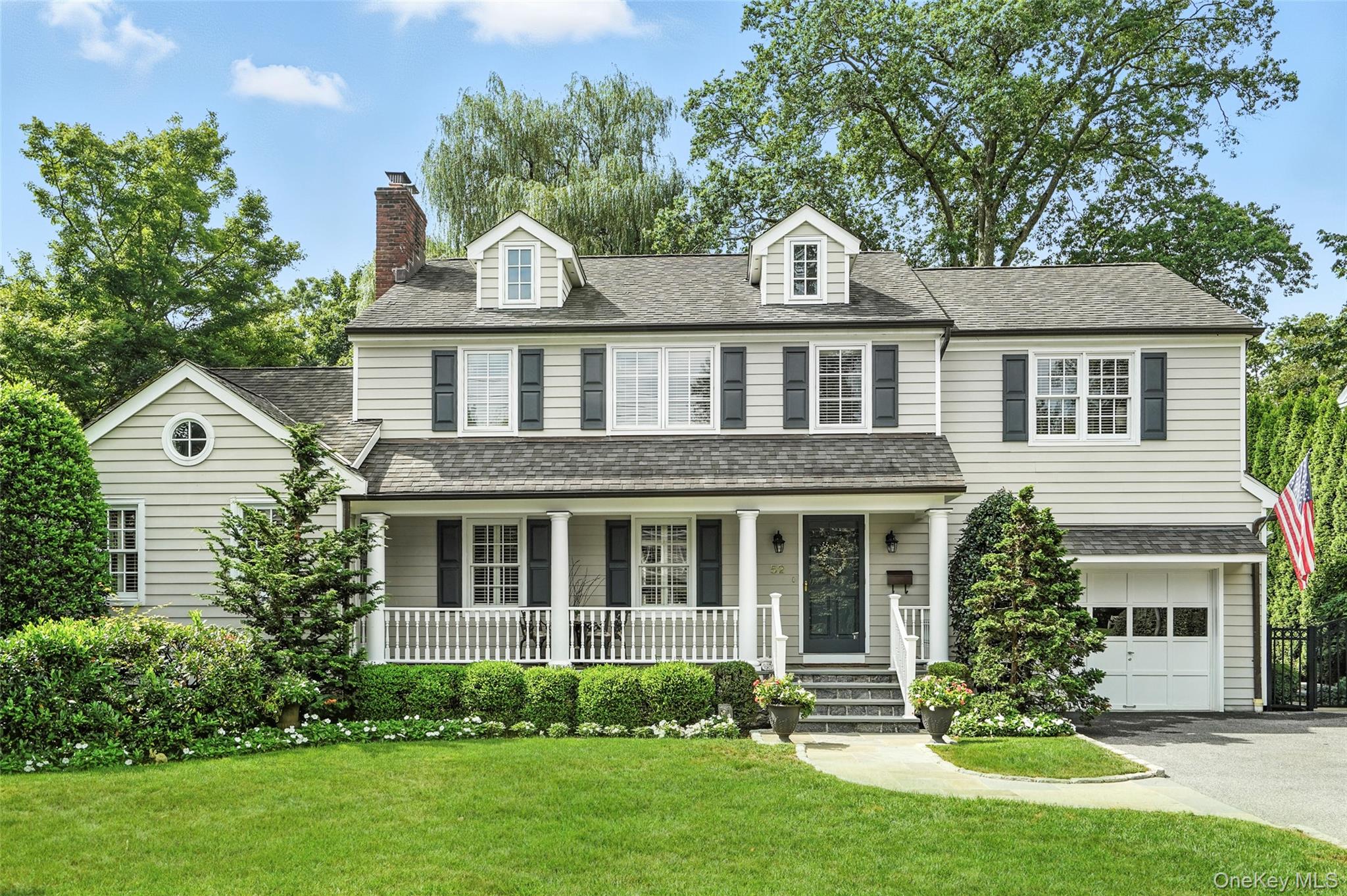 Charming colonial with classic front porch in an ideal, walk-to-everyt...