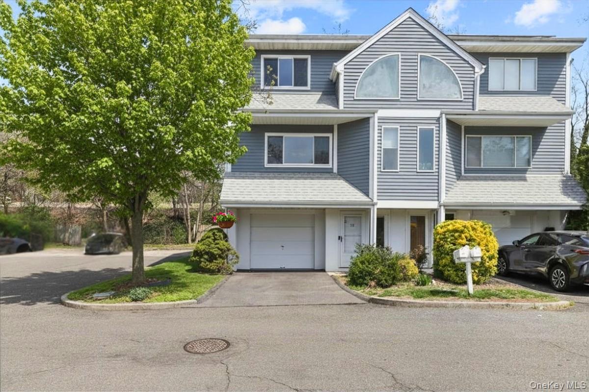 Welcome to 16 Wyman Street North, a bright and inviting three-level to...