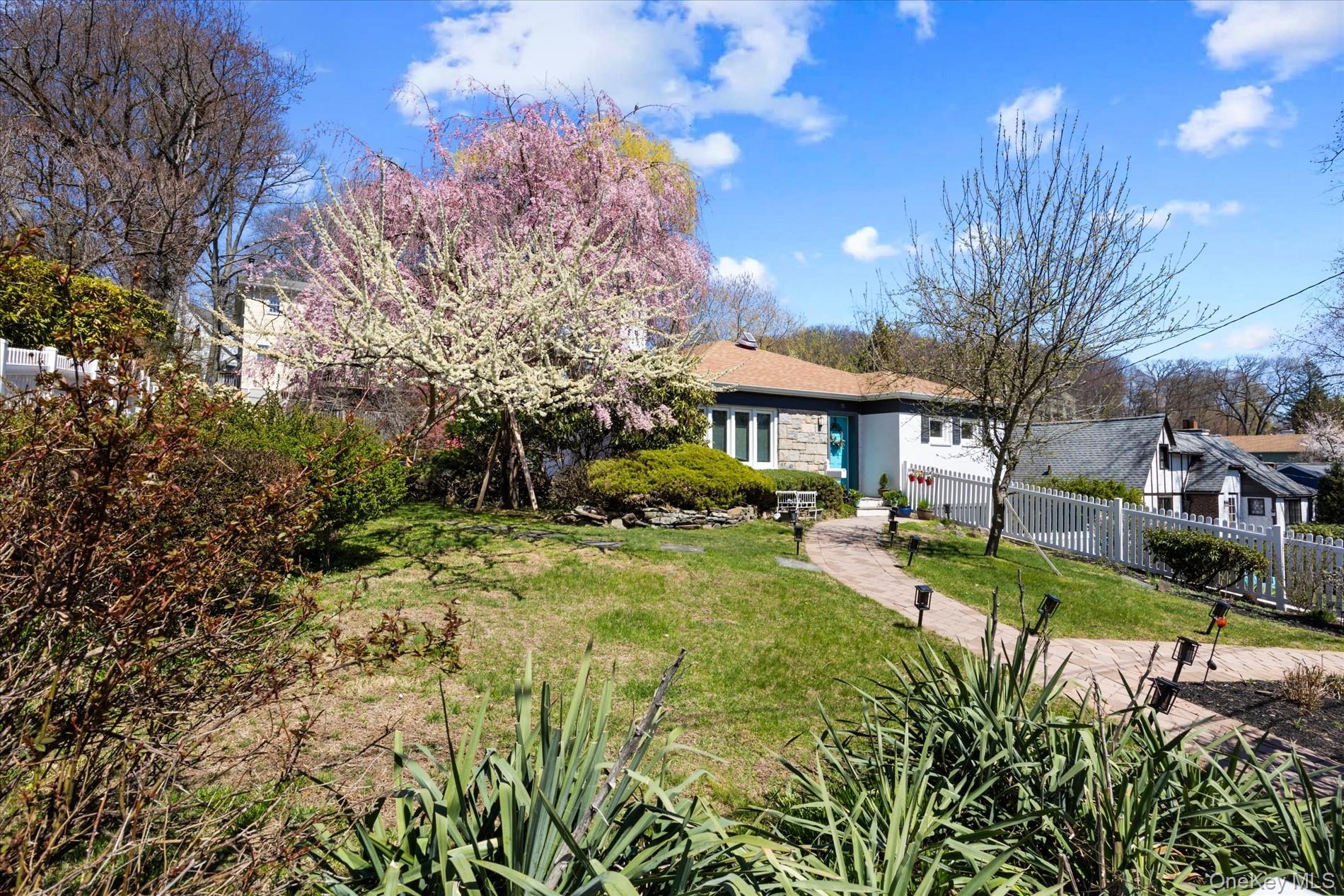 Set on a rare double lot, this beautifully renovated ranch-style home...