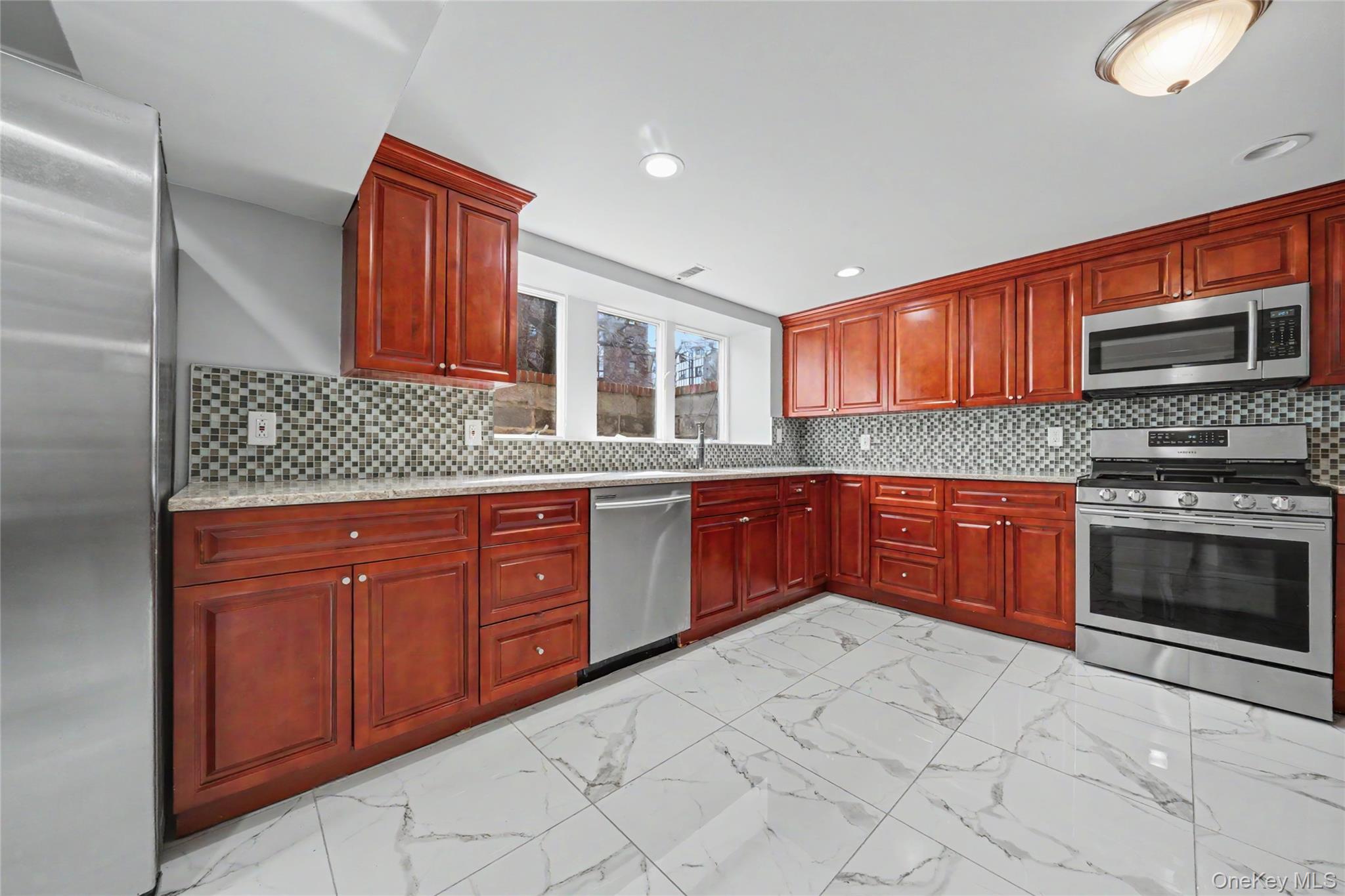 Beautifully renovated, this spacious 2 bedroom, 1 full bath ground lev...