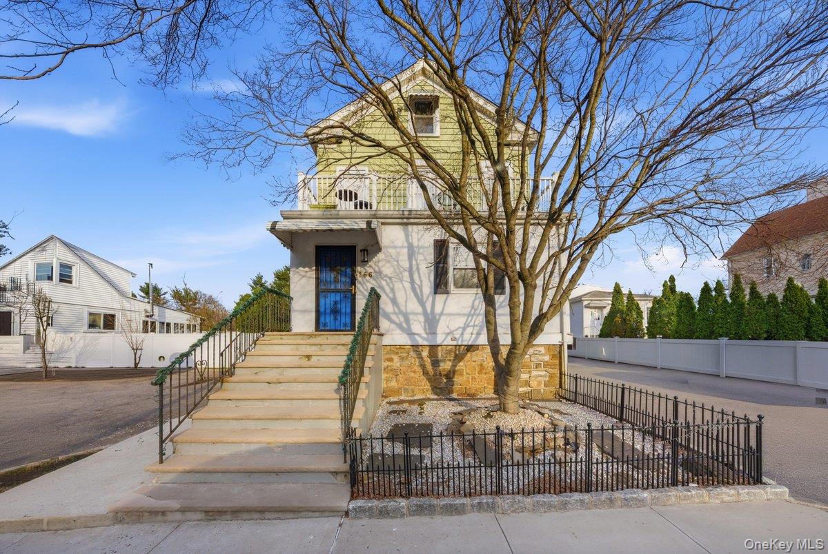 Introducing an exceptional legal two-family residence set in the heart...