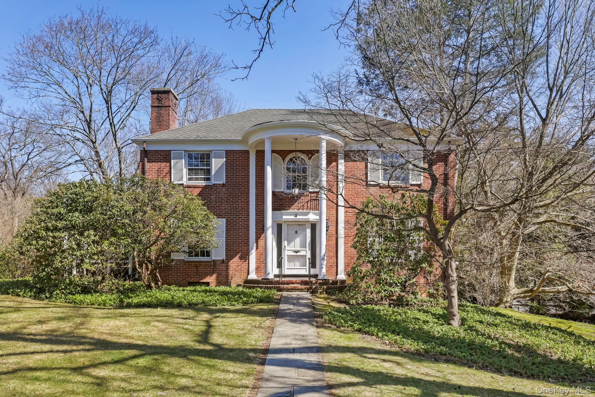 Sun-drenched and welcoming, this classic brick Colonial is located in...