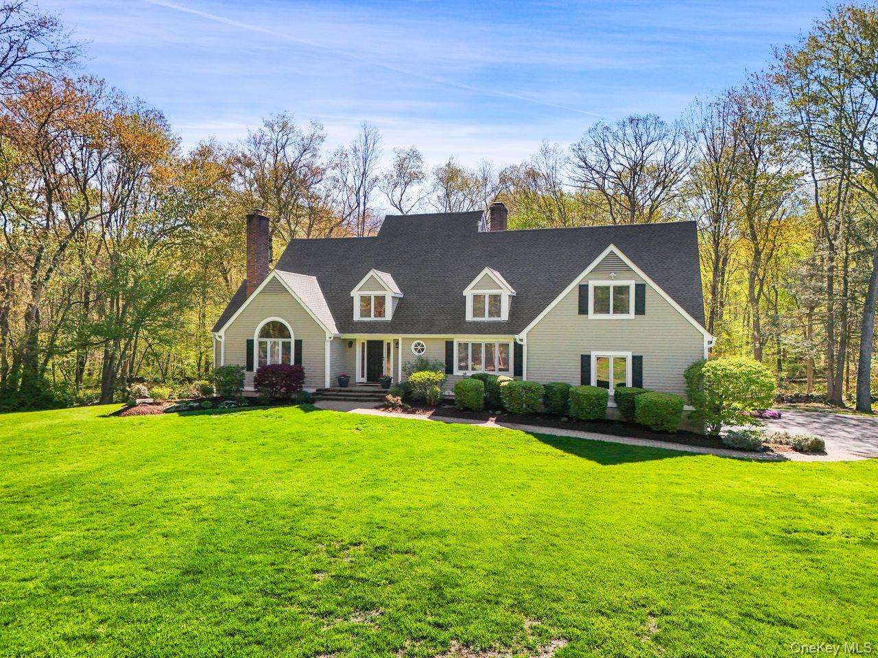 Set on 3.73 acres this elegant 4-bedroom, 2.5-bath colonial offers soa...