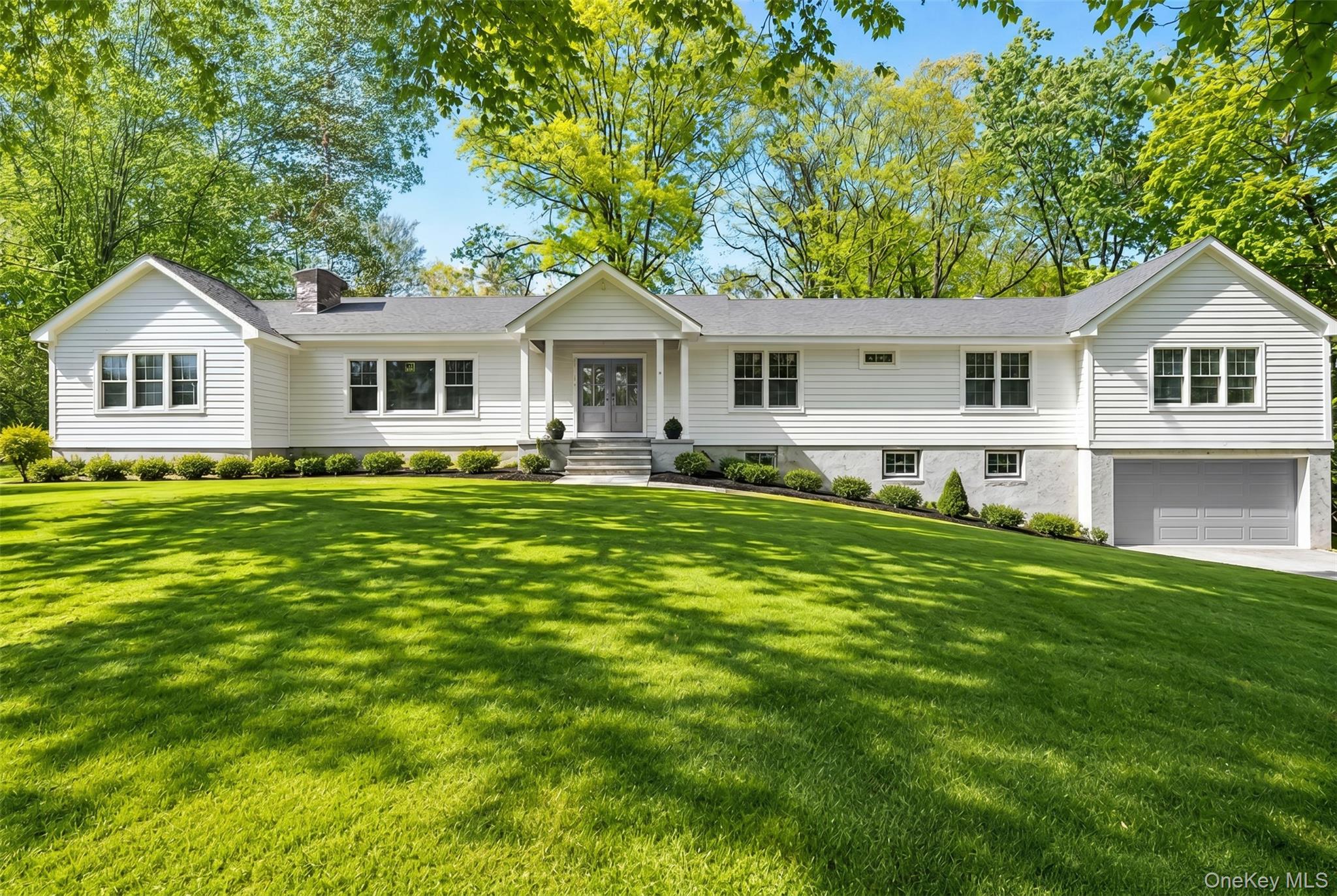 Set in the heart of Quaker Ridge, this exceptional, fully renovated Ra...