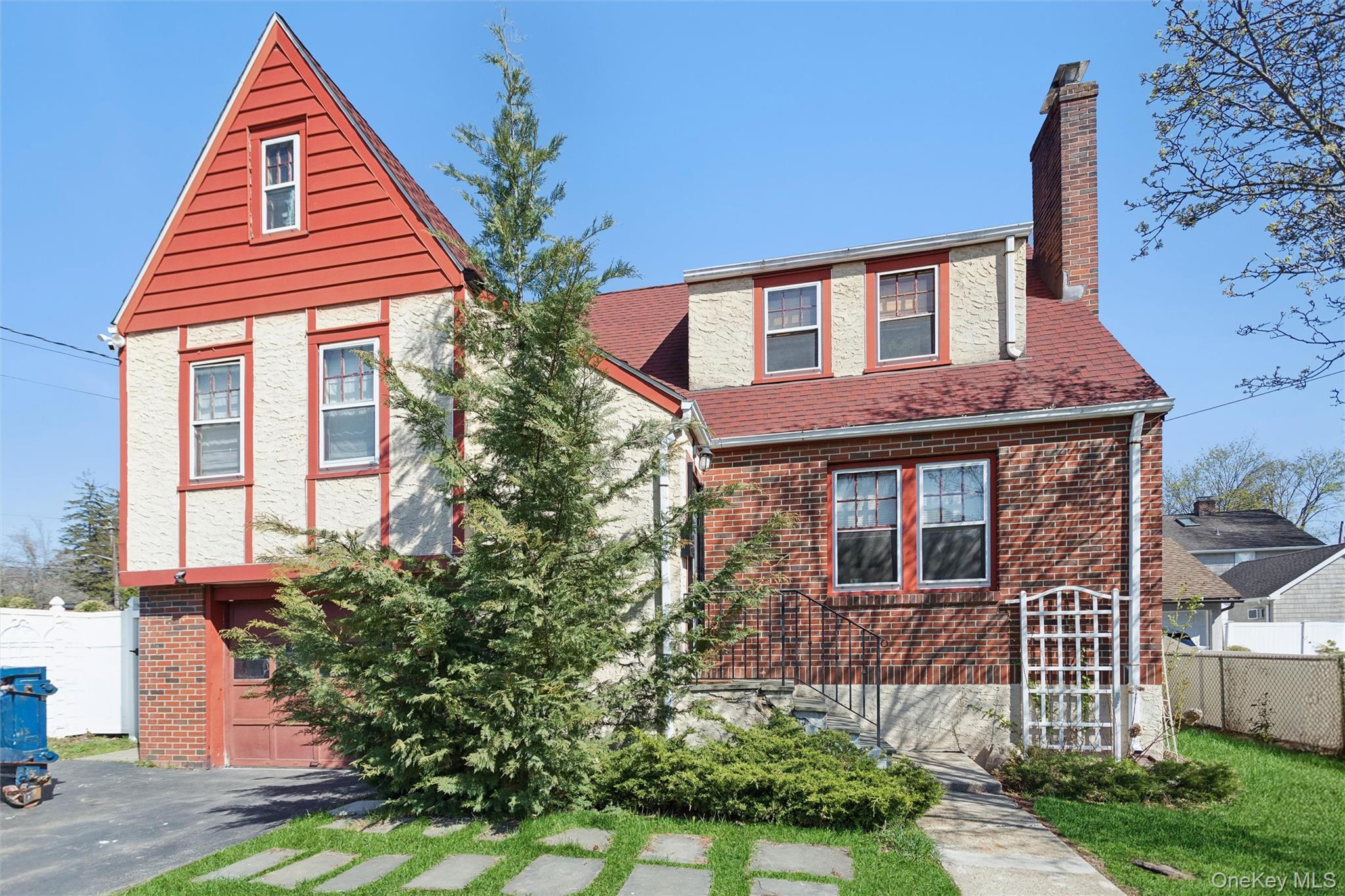We do not see a lot of staggered Tudors, but the home at 229 North Reg...