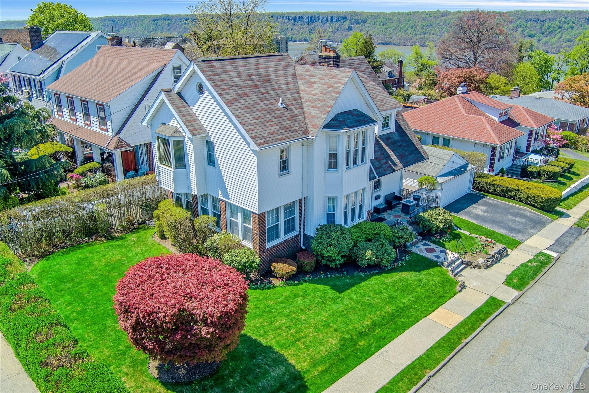 "CORNERSTONE COLONIAL" - Set on a prominent corner parcel in the covet...