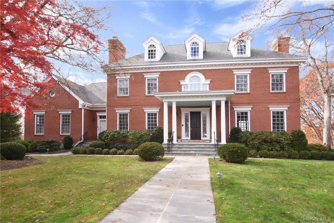 This impressive brick Colonial enjoys unobstructed river views from al...