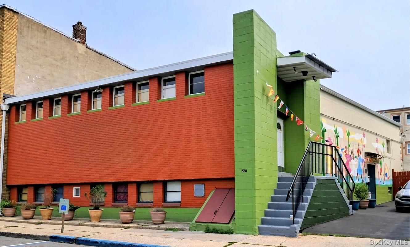 This completely renovated, versatile, energy-efficient bi-level buildi...