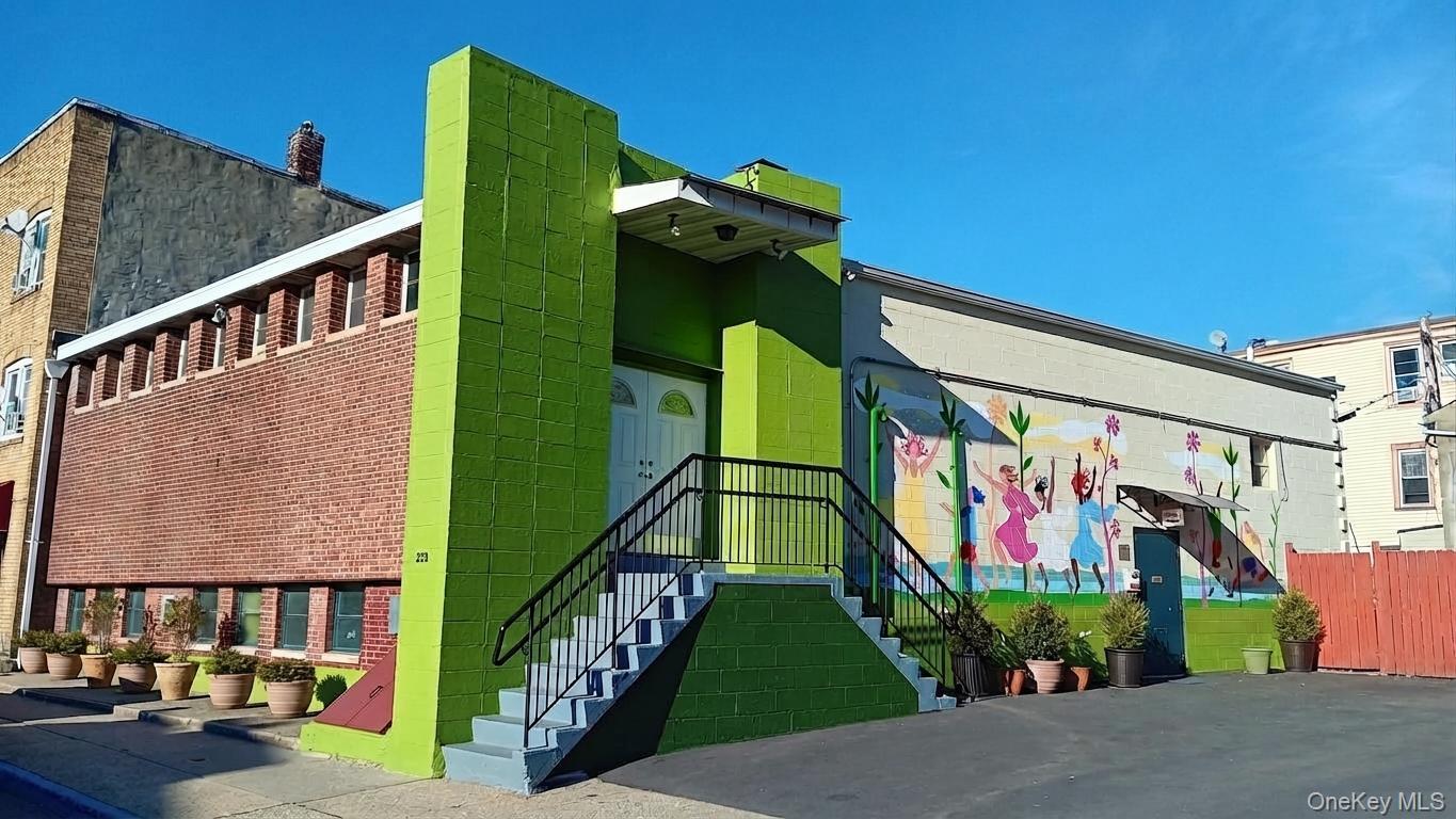 This completely renovated, versatile, energy-efficient bi-level buildi...