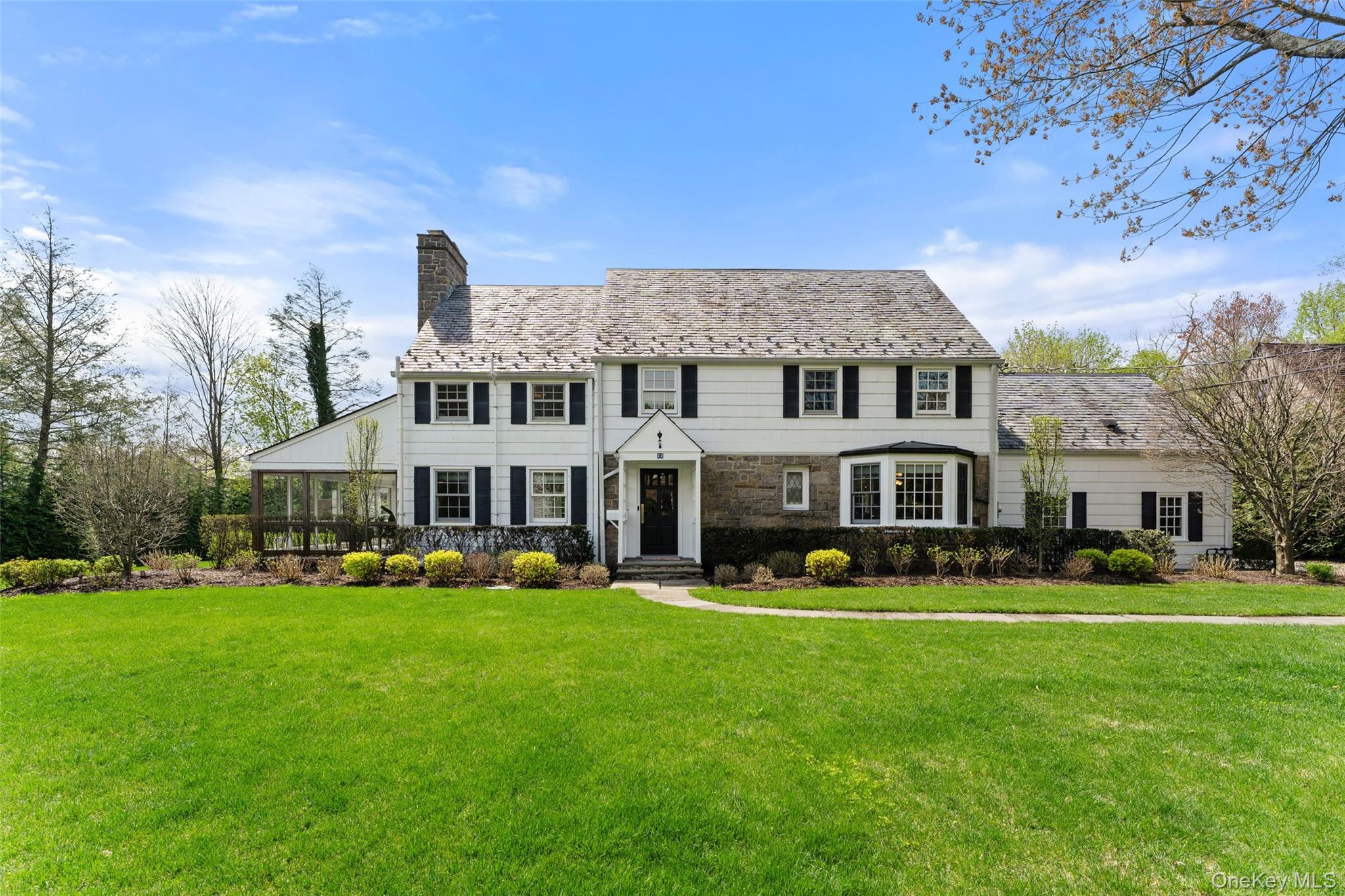 Set on nearly half an acre of level, beautifully reimagined grounds on...