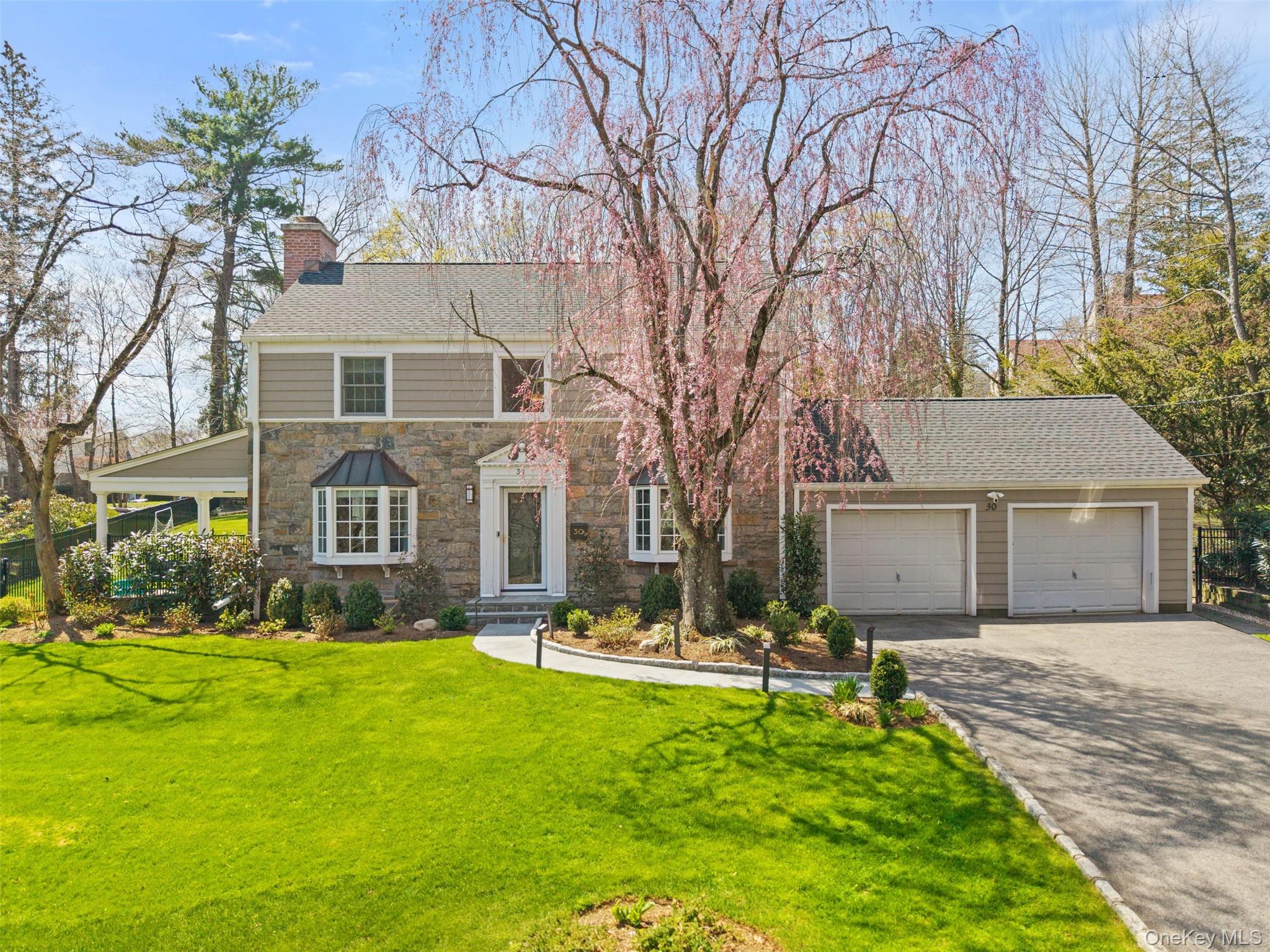 This spectacular Scarsdale colonial is the ultimate in modern convenie...