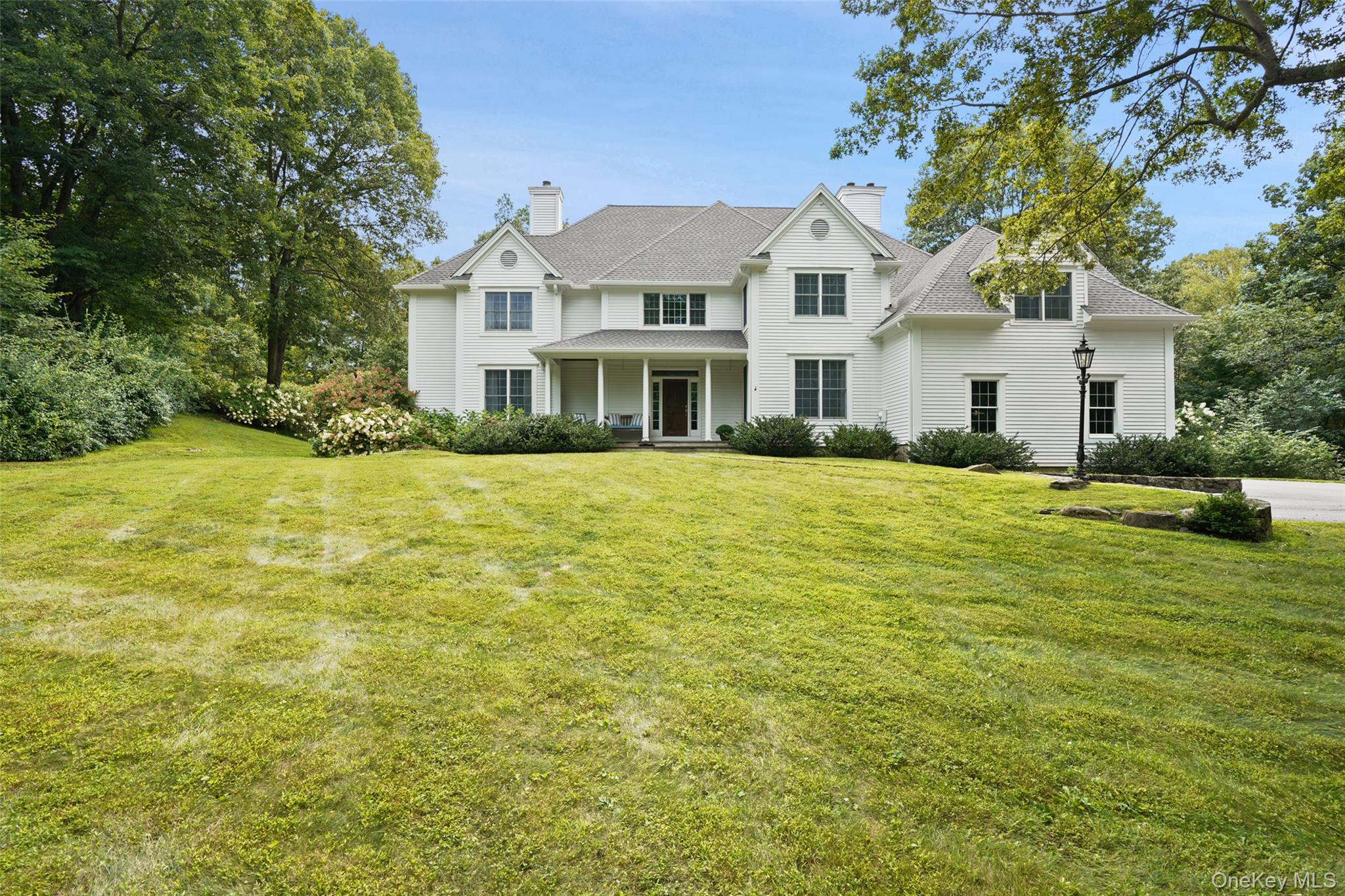 Set gracefully back from a cul-de-sac on 3 private acres, this well-ma...
