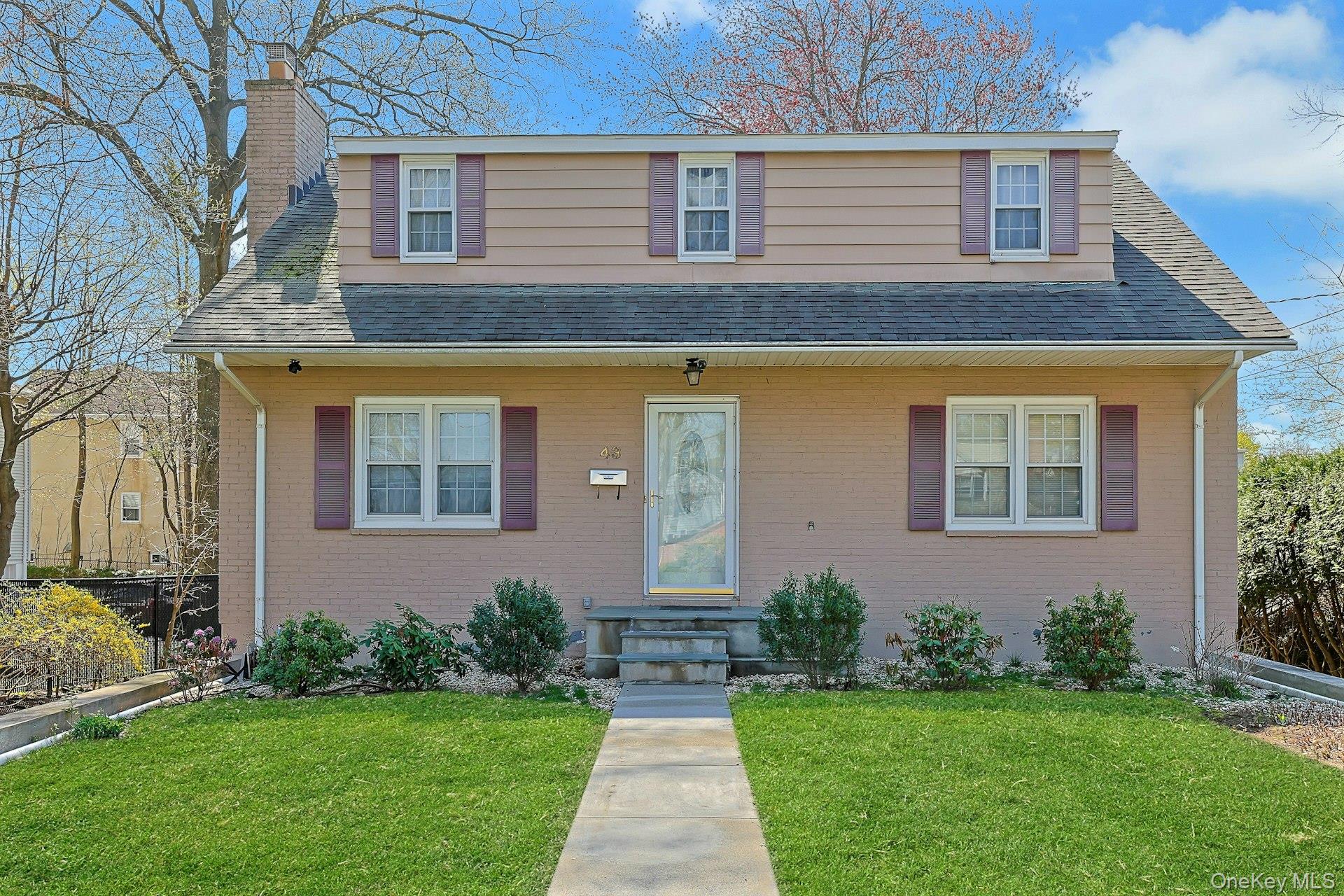 Welcome to 43 John Alden Road, a charming home nestled in one of New R...