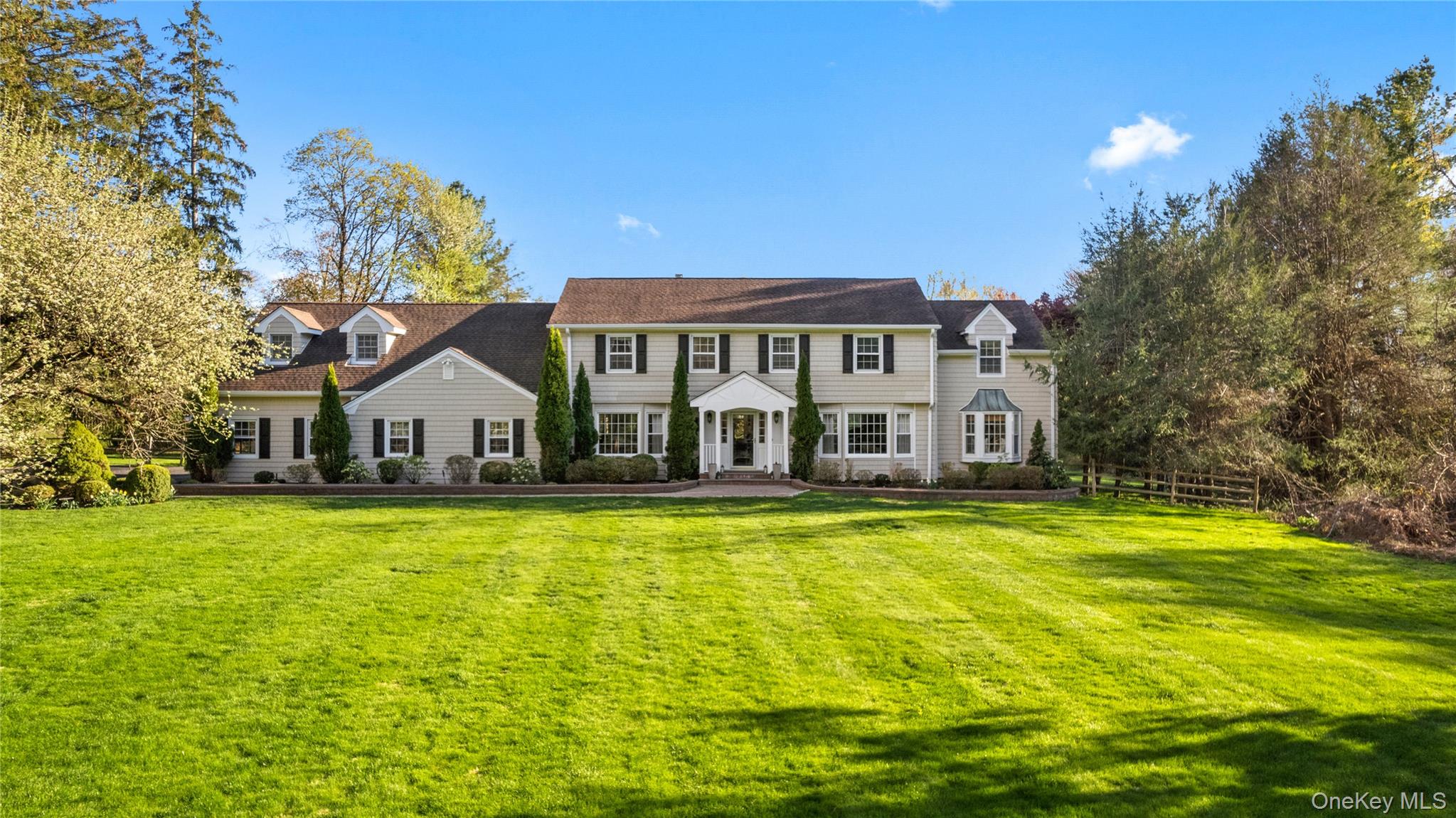 Set on over two acres of lush, level grounds, this magnificent traditi...