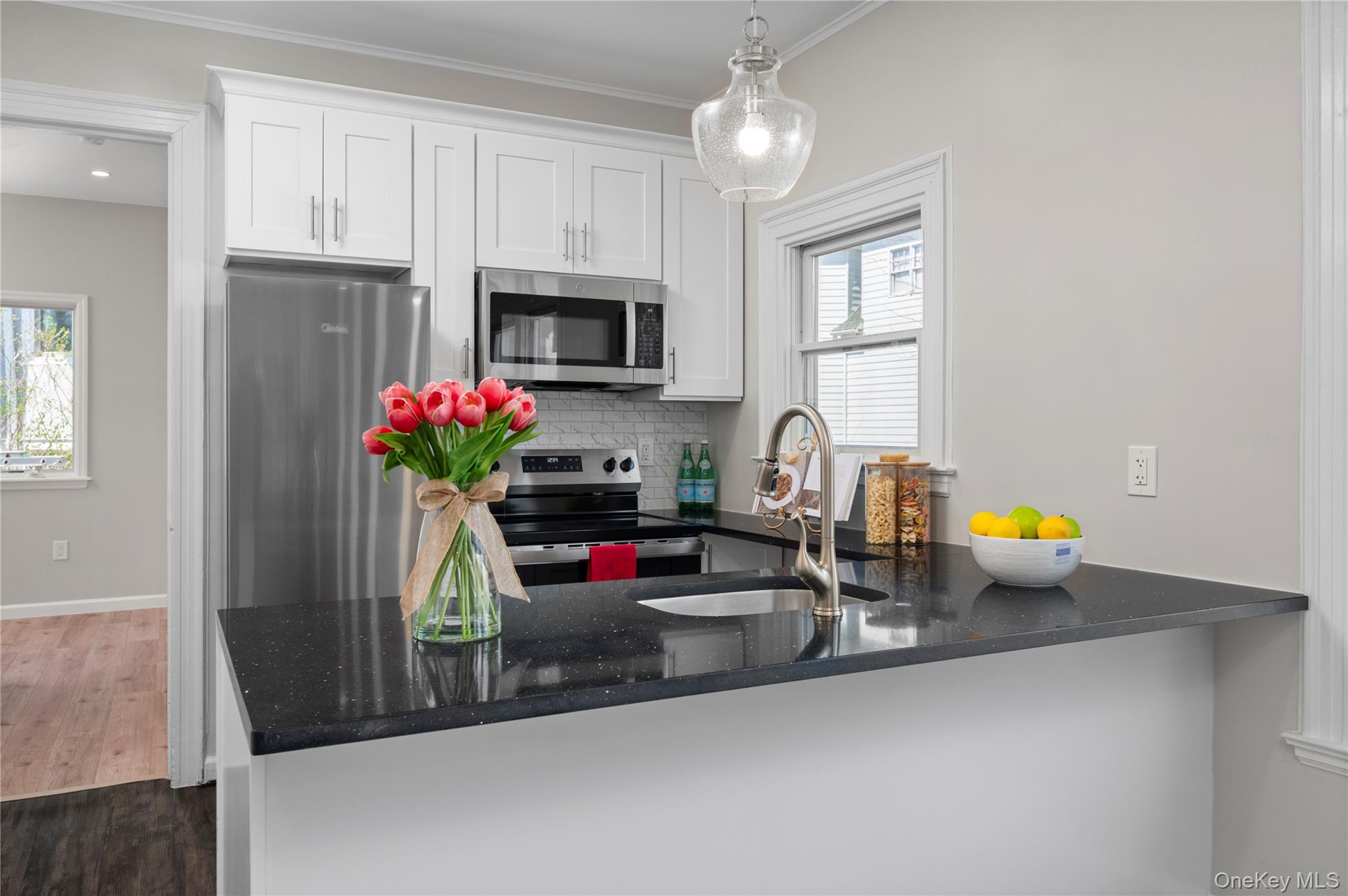 Sun-filled and freshly renovated, this first-floor apartment offers a...