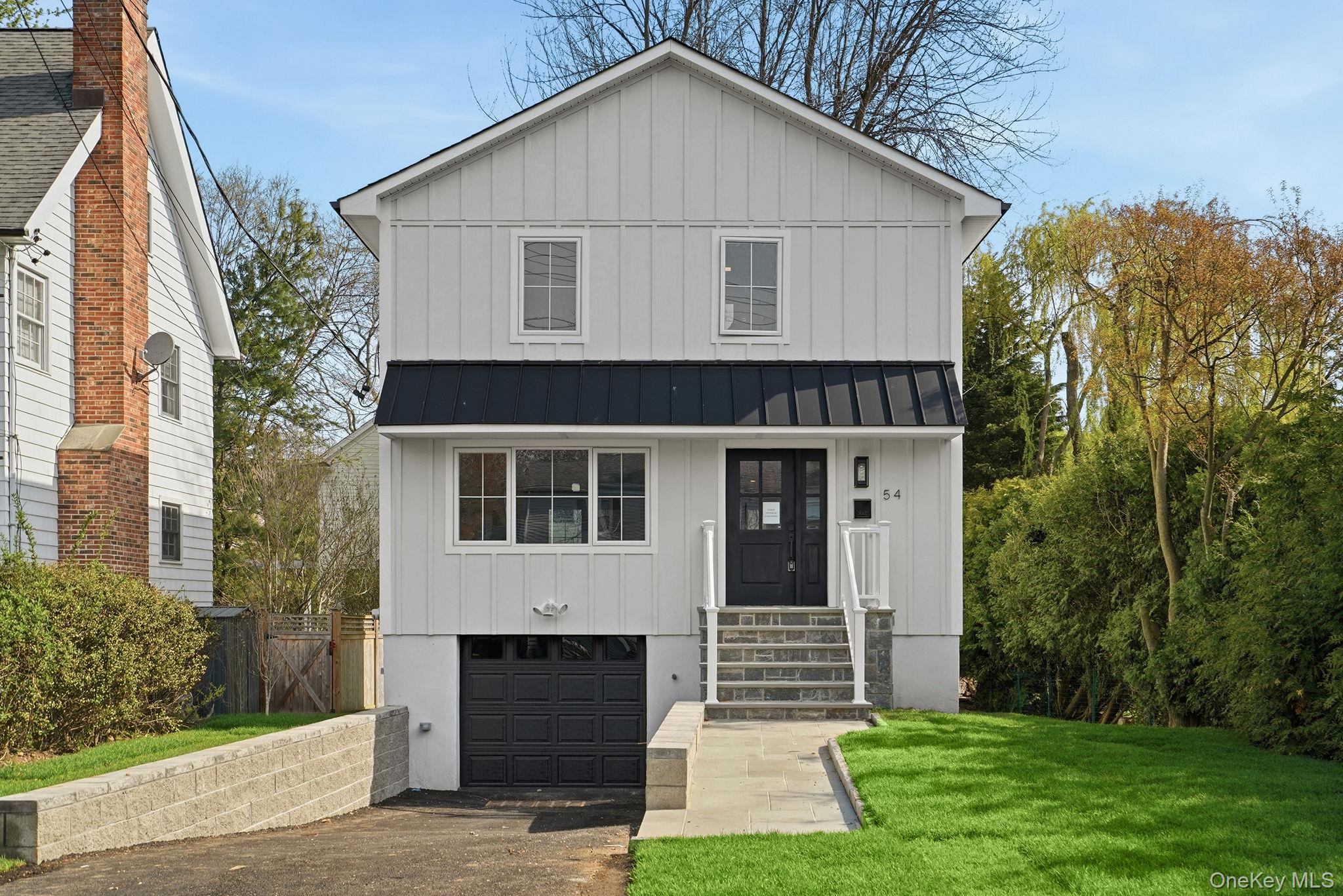 Tastefully renovated, turn-key Colonial offering modern design and loc...