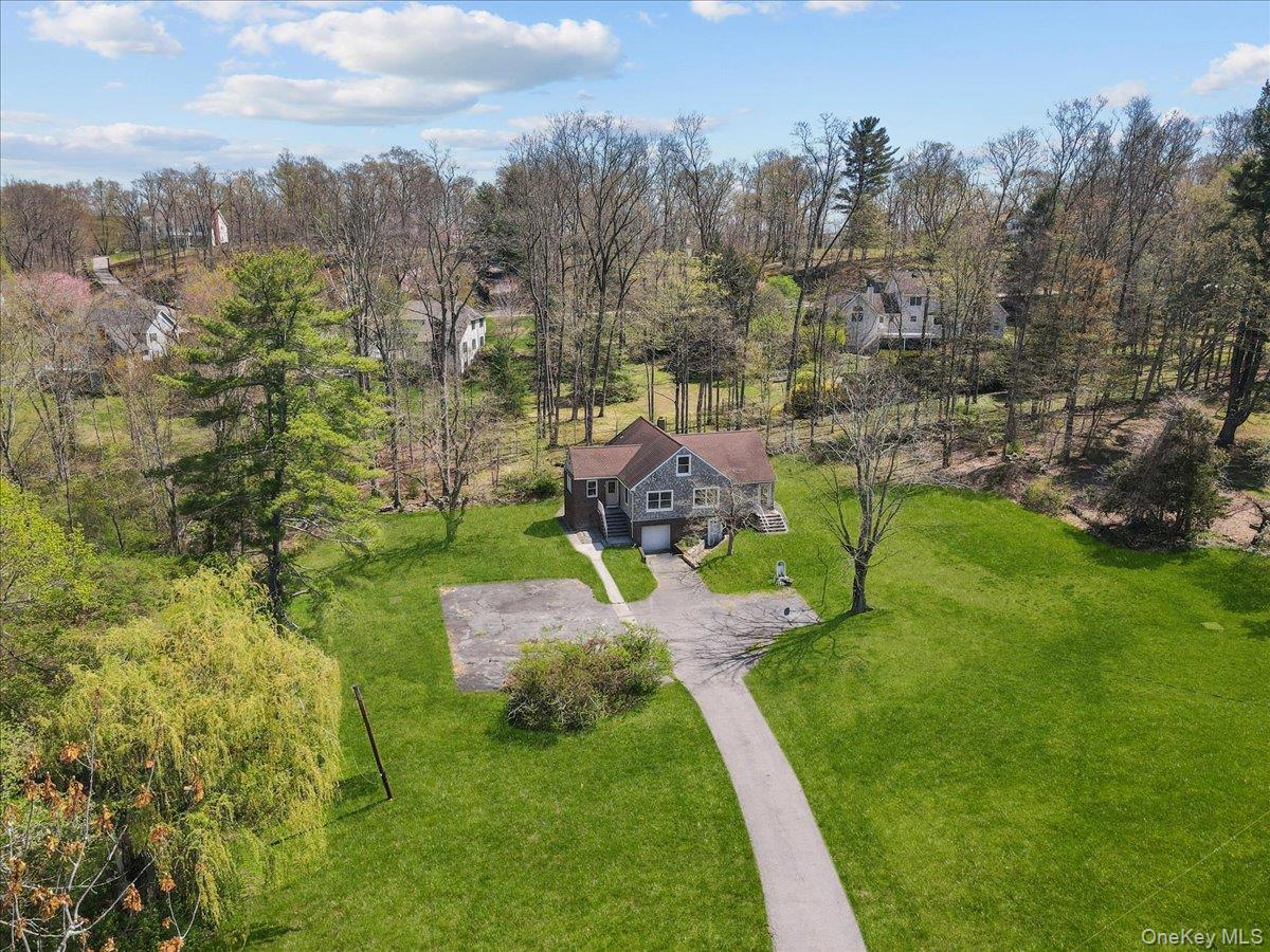 Welcome to 9 South Lane, privately set on 1.28 acres in the Somers Sch...
