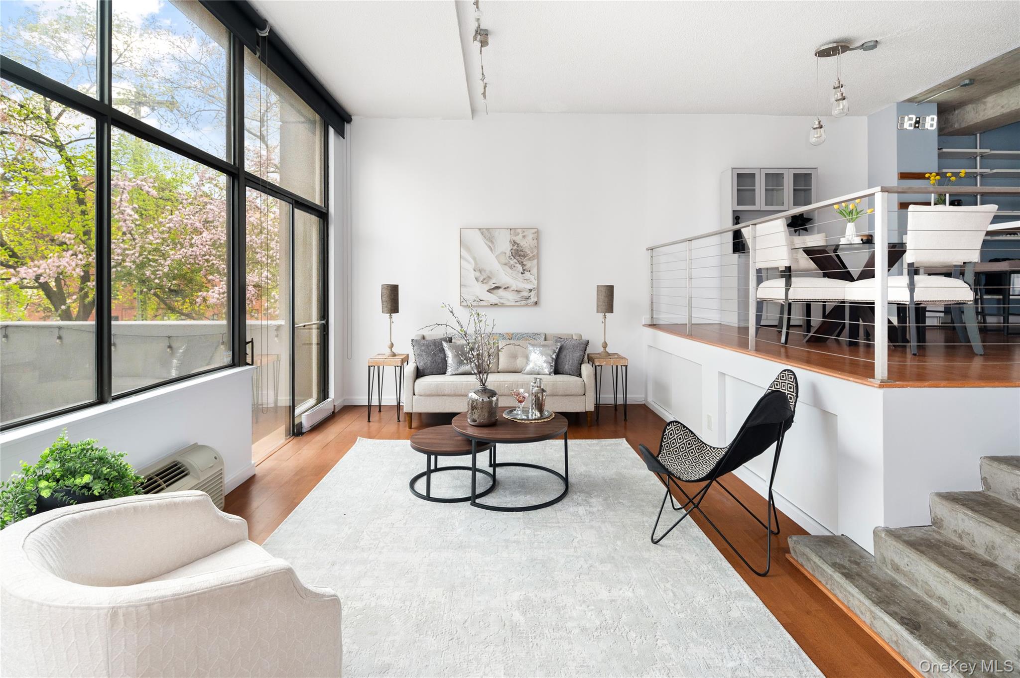 Sophisticated urban living in this rare duplex condo located in a full...