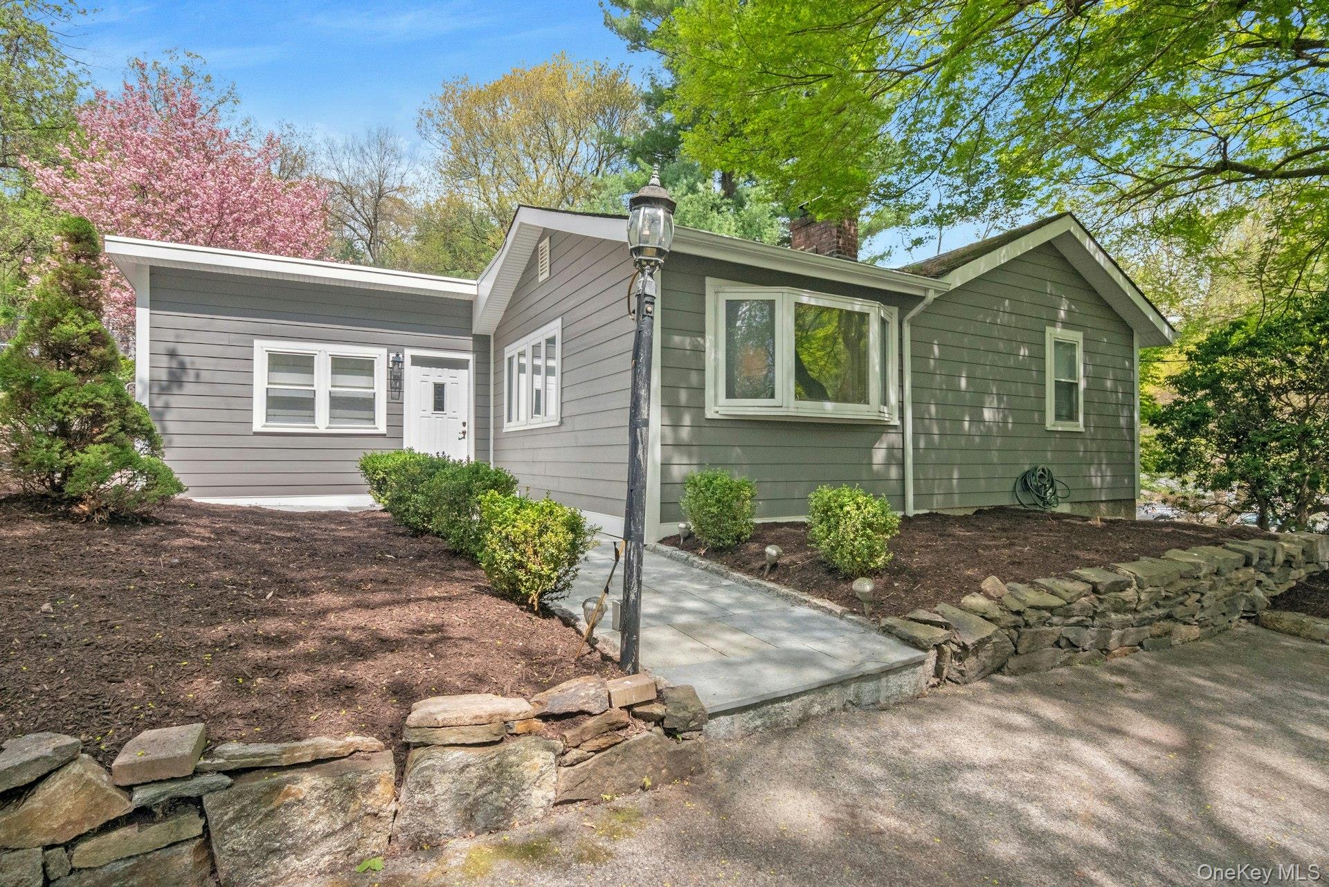 Welcome to 199 Taxter Road your private oasis. a charming Ranch in Irv...