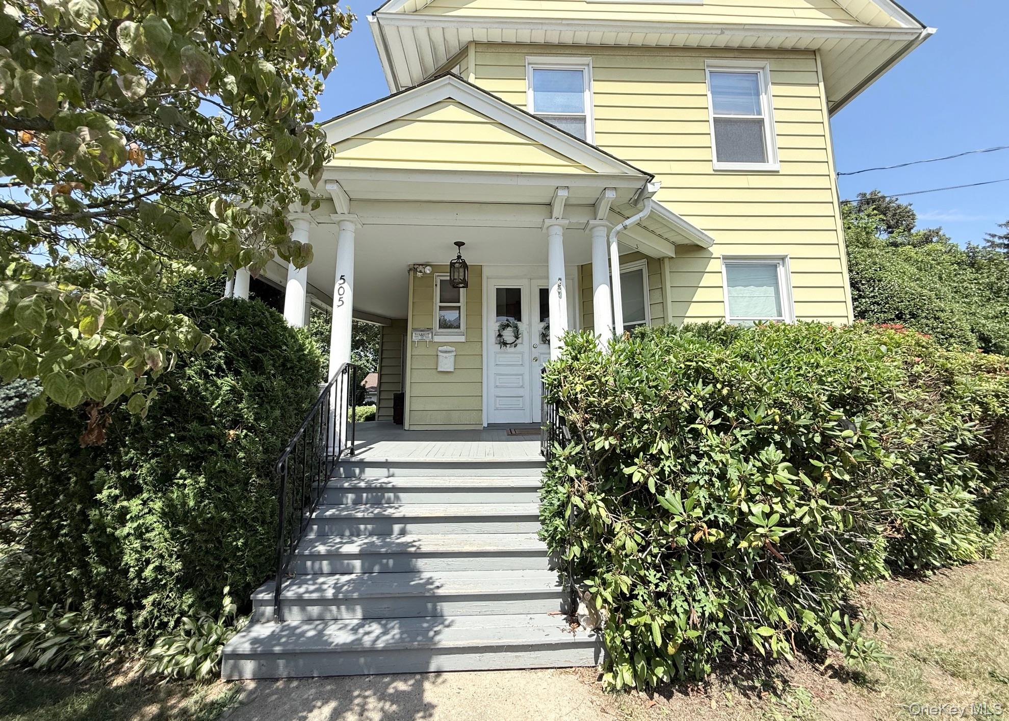 Welcome to this Vintage Village Colonial with wrap around front porch...