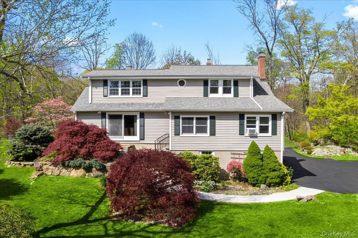 Nestled on over 2 private, estate-like acres in the highly sought-afte...