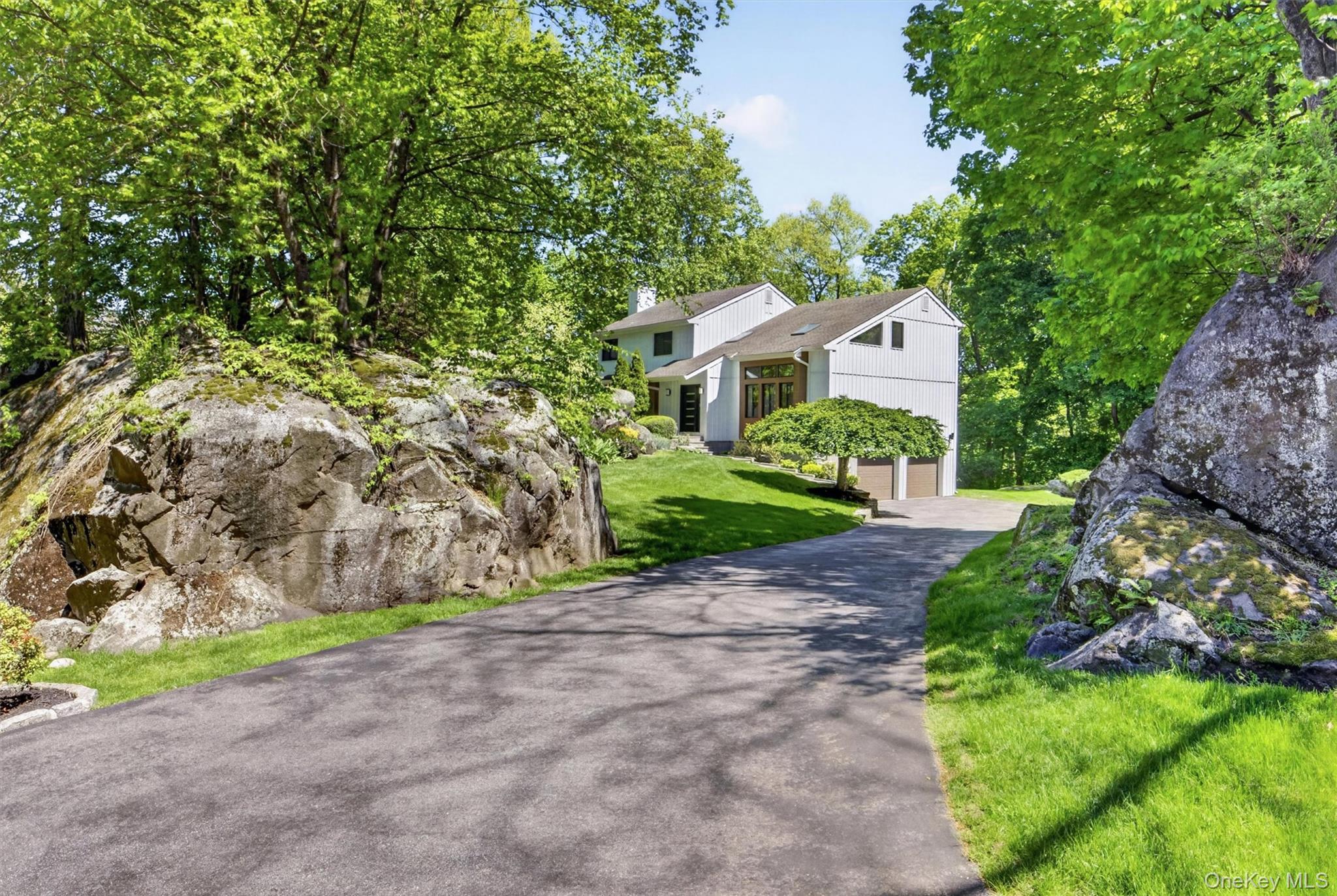 Reimagined with a minimalist aesthetic, this Contemporary Colonial ble...