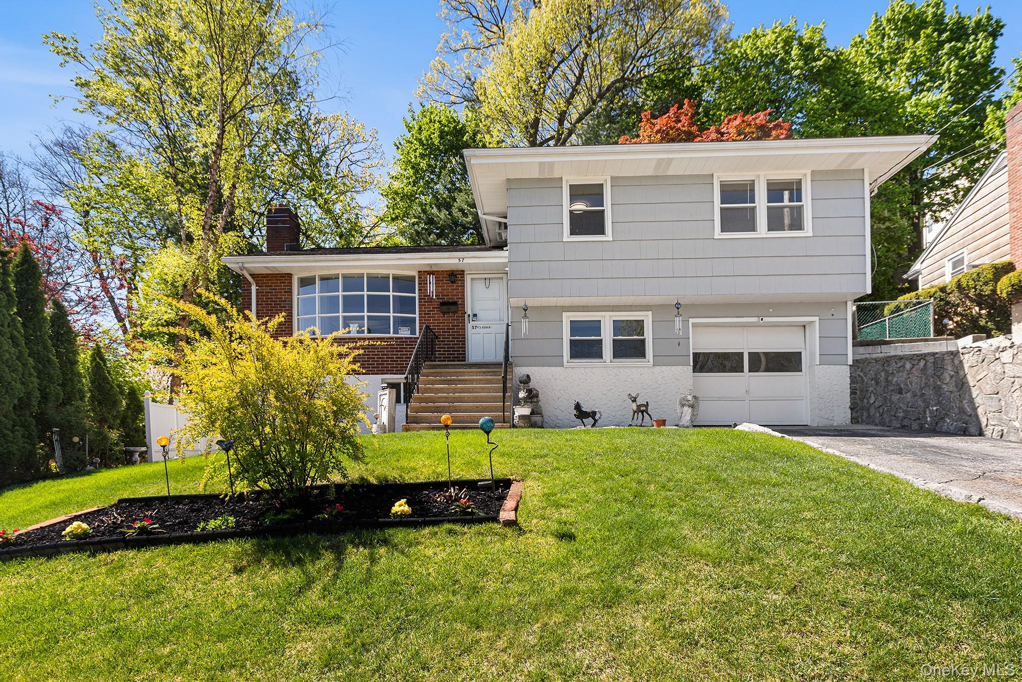 This well-maintained split level checks all the boxes and then some. H...
