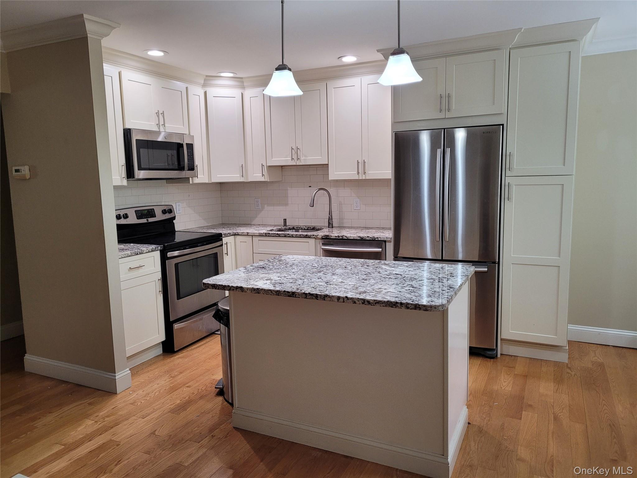 Bright and inviting first-floor condo in desirable Jefferson Village,...
