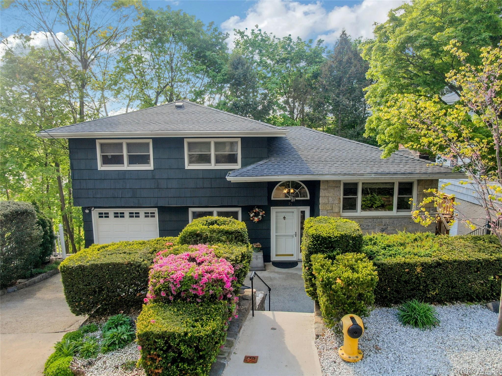 Welcome to 77 Bella Vista, a three-bedroom, two-bath split-level home...