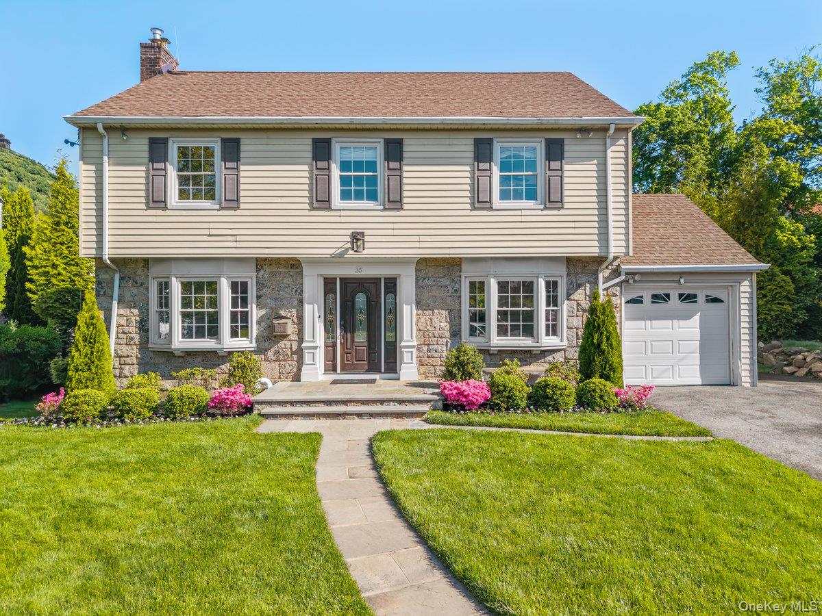 A picture-perfect, turnkey Colonial beautifully sited on magnificent,...