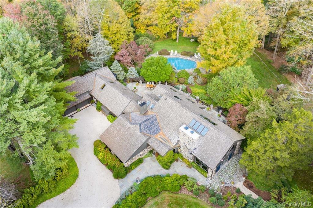 This one-of-a-kind 5 bedroom, 5 full bathroom rustic Adirondack-style...