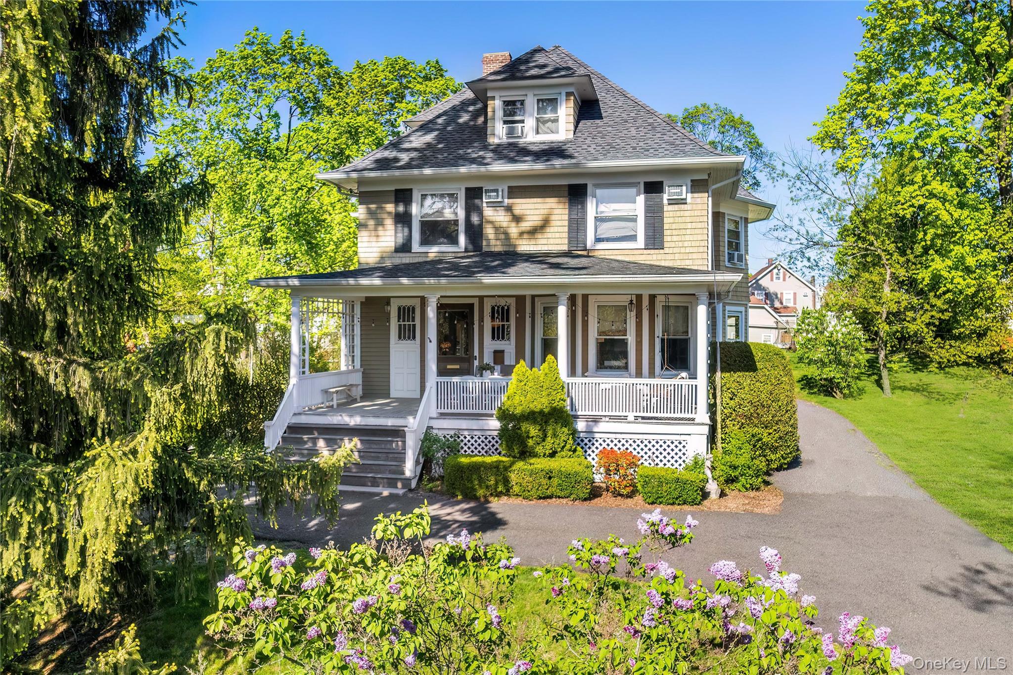 Perched high on a hill on one of Rye Brook’s favorite streets, this wo...