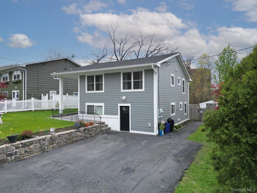 Welcome to this wonderful and thoughtfully updated split-level home, i...