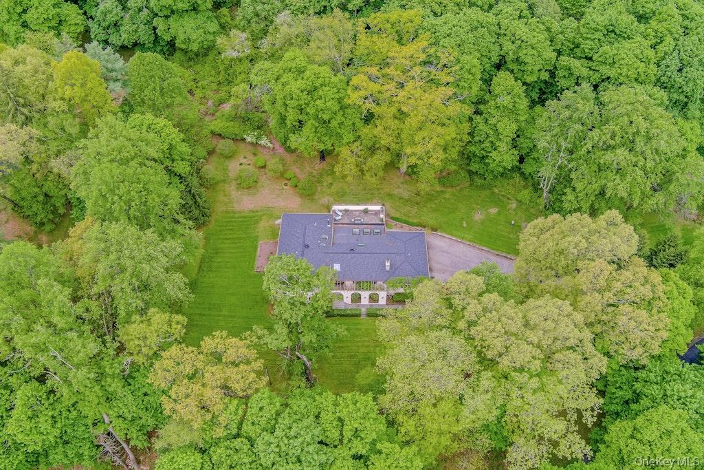 Set on 2.63 private acres on one of the Village’s most desirable stree...