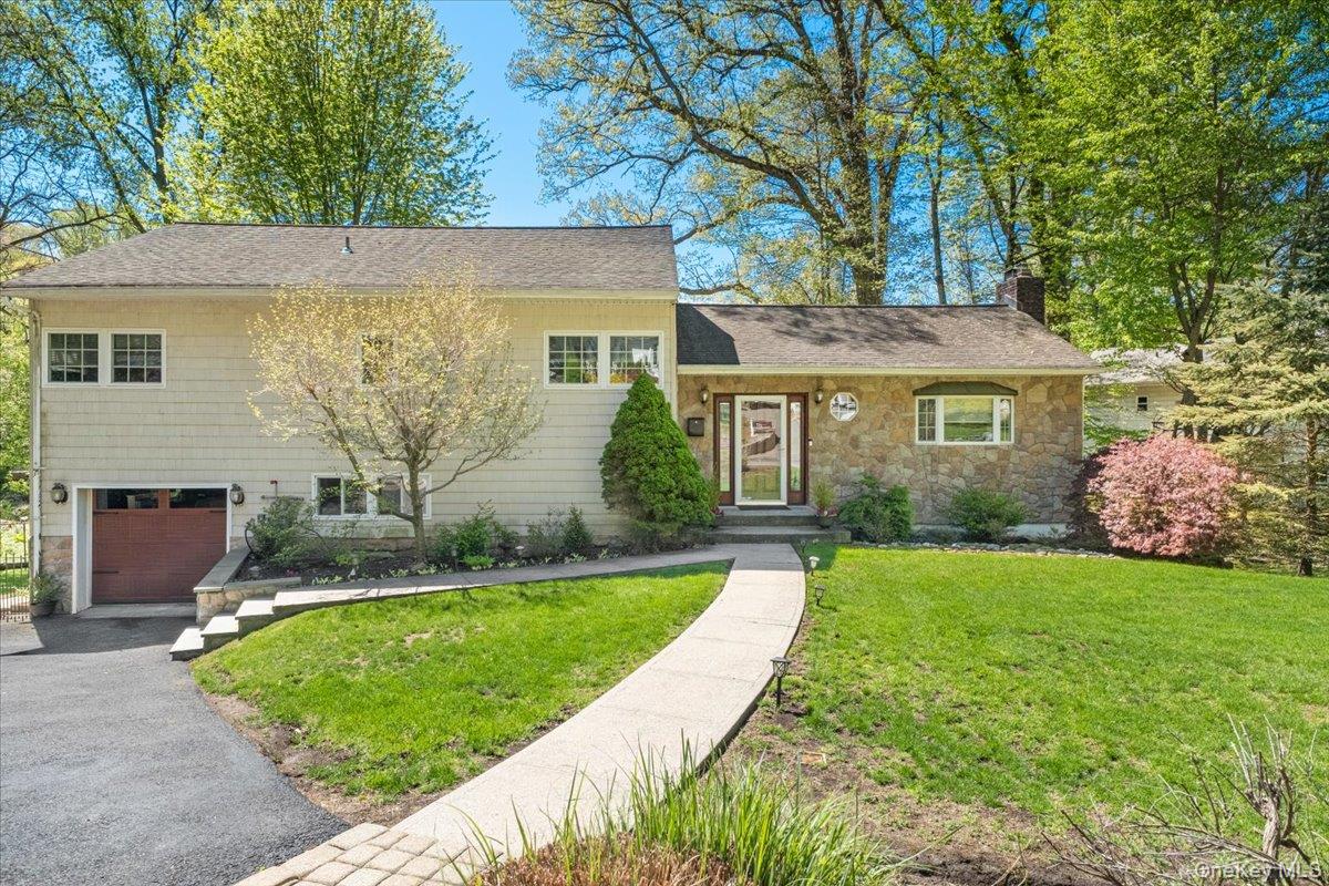 Welcome to this charming split-level home located on a desirable, quie...