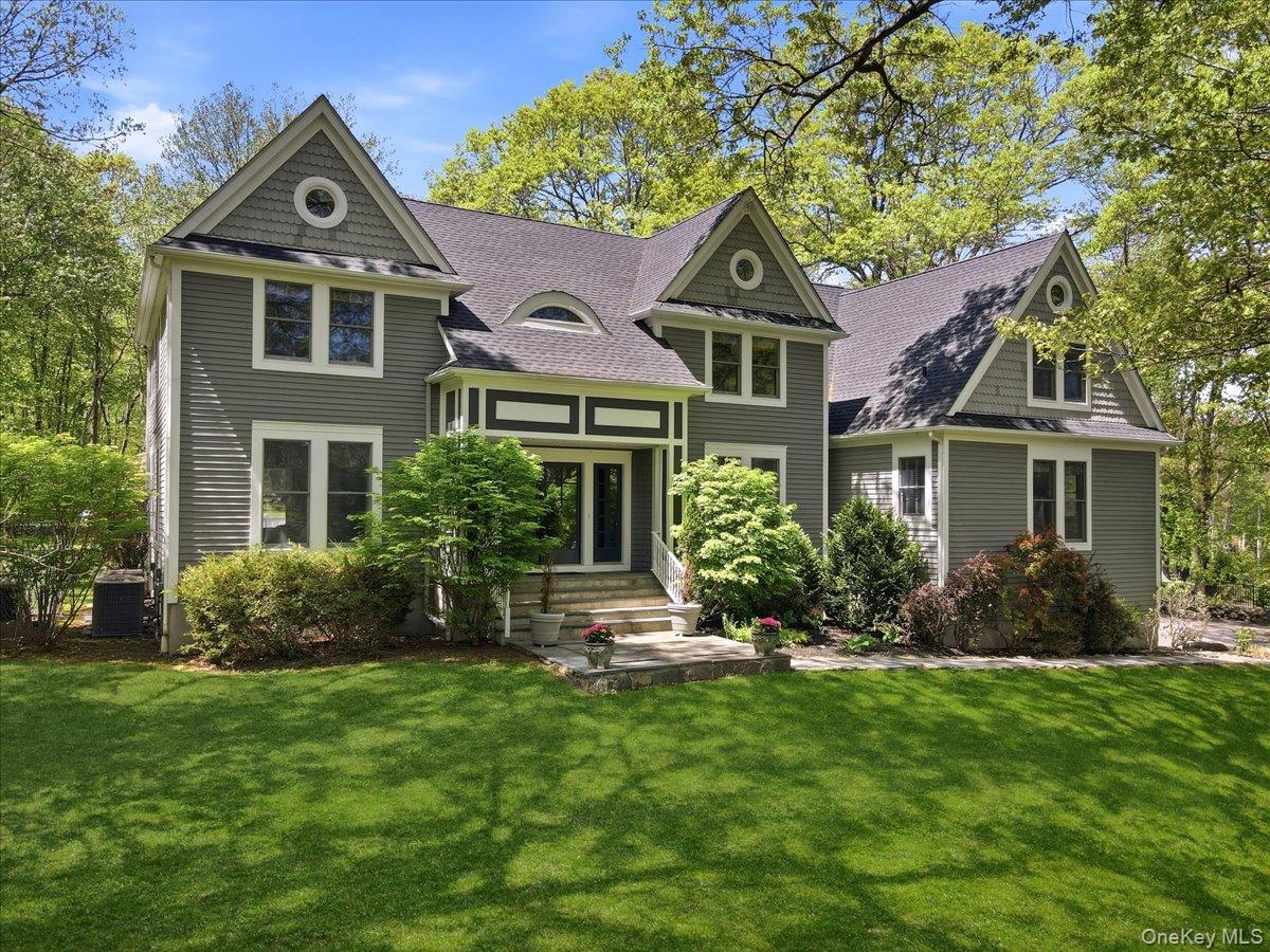 Beautifully set on 2.29 private acres, this updated Colonial blends cl...