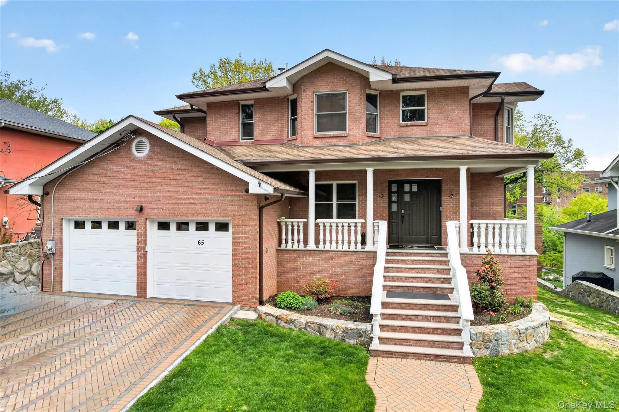 Welcome to 65 Wildway, a stunning residence set within one of Bronxvil...