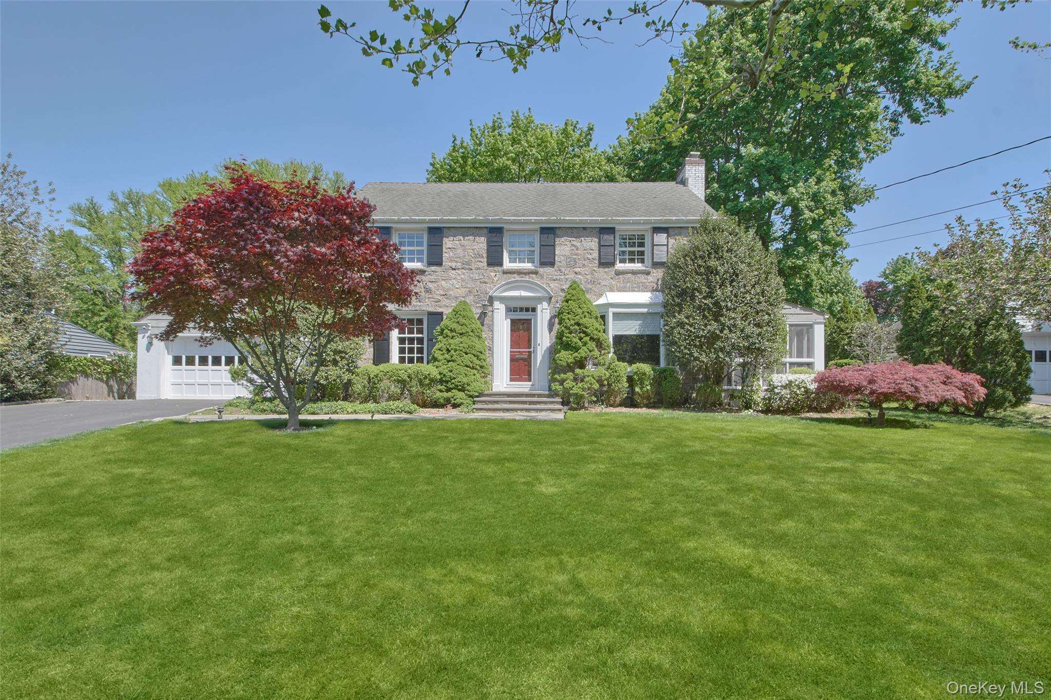 Charming Stone Front Colonial on beautifully landscaped 0.38 acre in d...