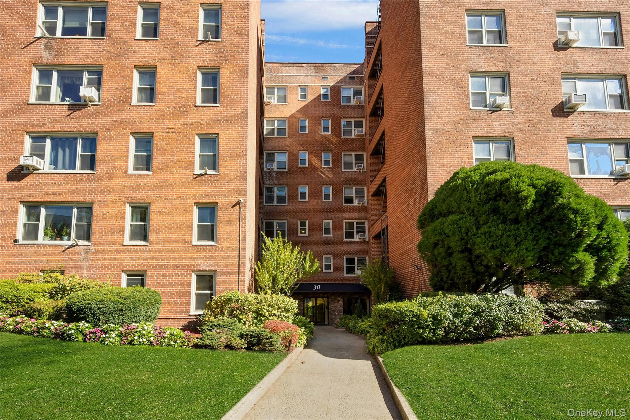 Welcome to 30 N Broadway, Unit #5E — a spacious and beautifully mainta...