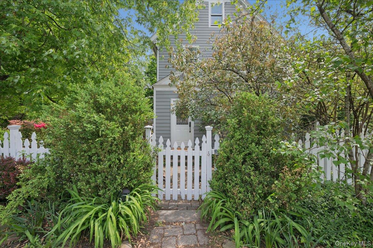 Step into the charm of this 1922 expanded Colonial, situated on a sere...